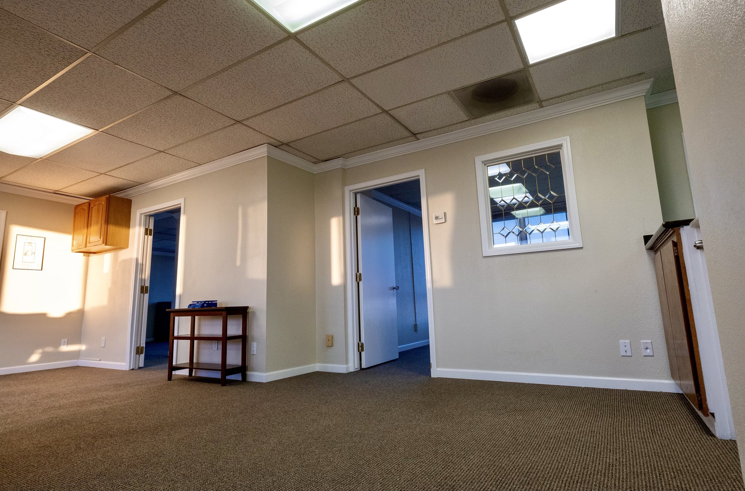 The door to office A is in the left-hand corner of the office