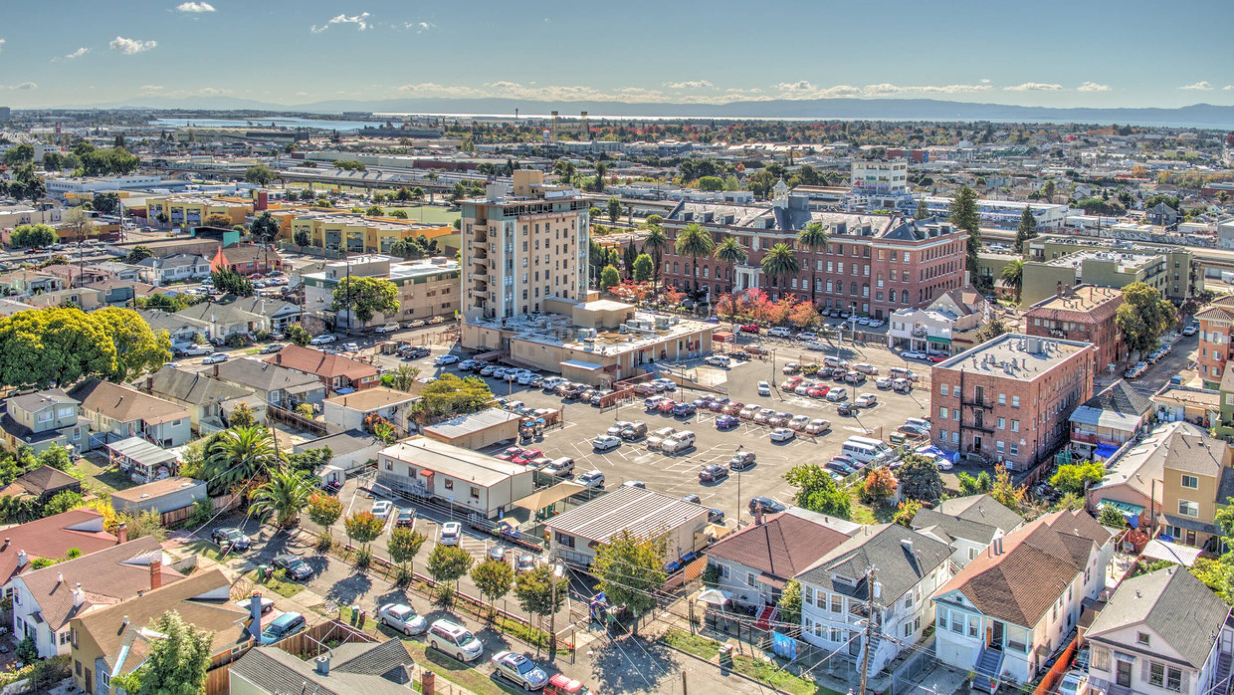 Aerial view of the Fruitvale Gateway building showing all three parking lots