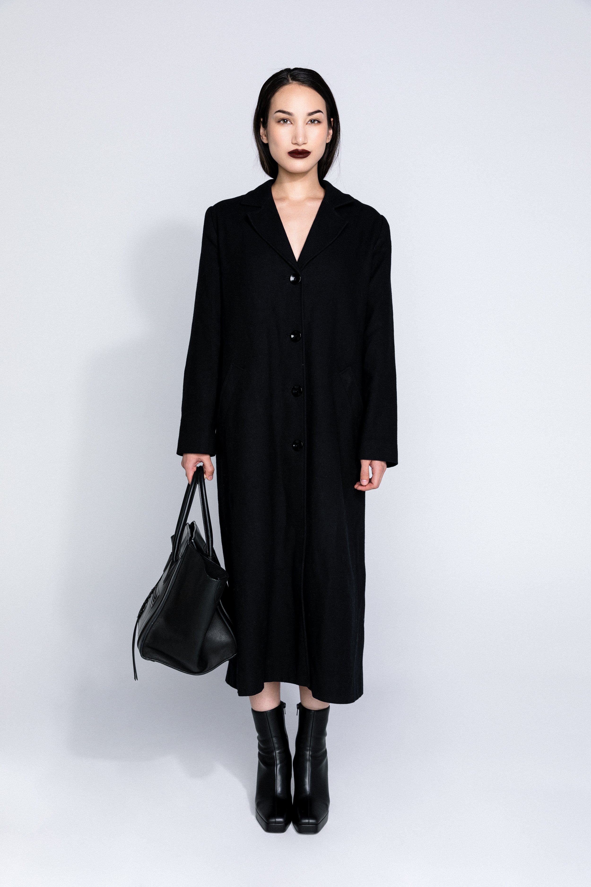 In contrast, Look 2 makes a defiant statement with a matte burgundy lip, drawing attention to the high-contrast frame of the garment.