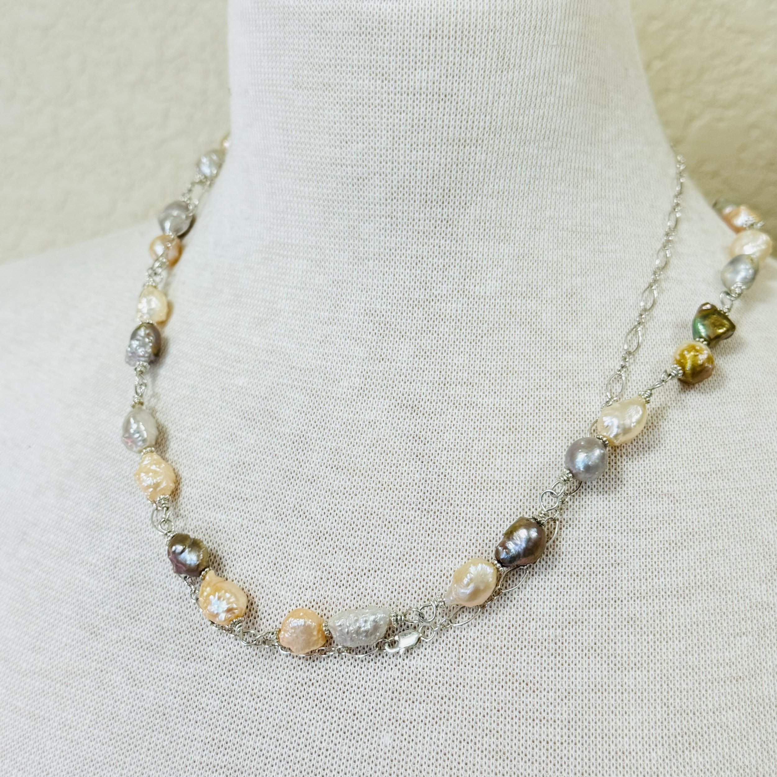 Hand wrapped multicolored pearl long necklace strand.