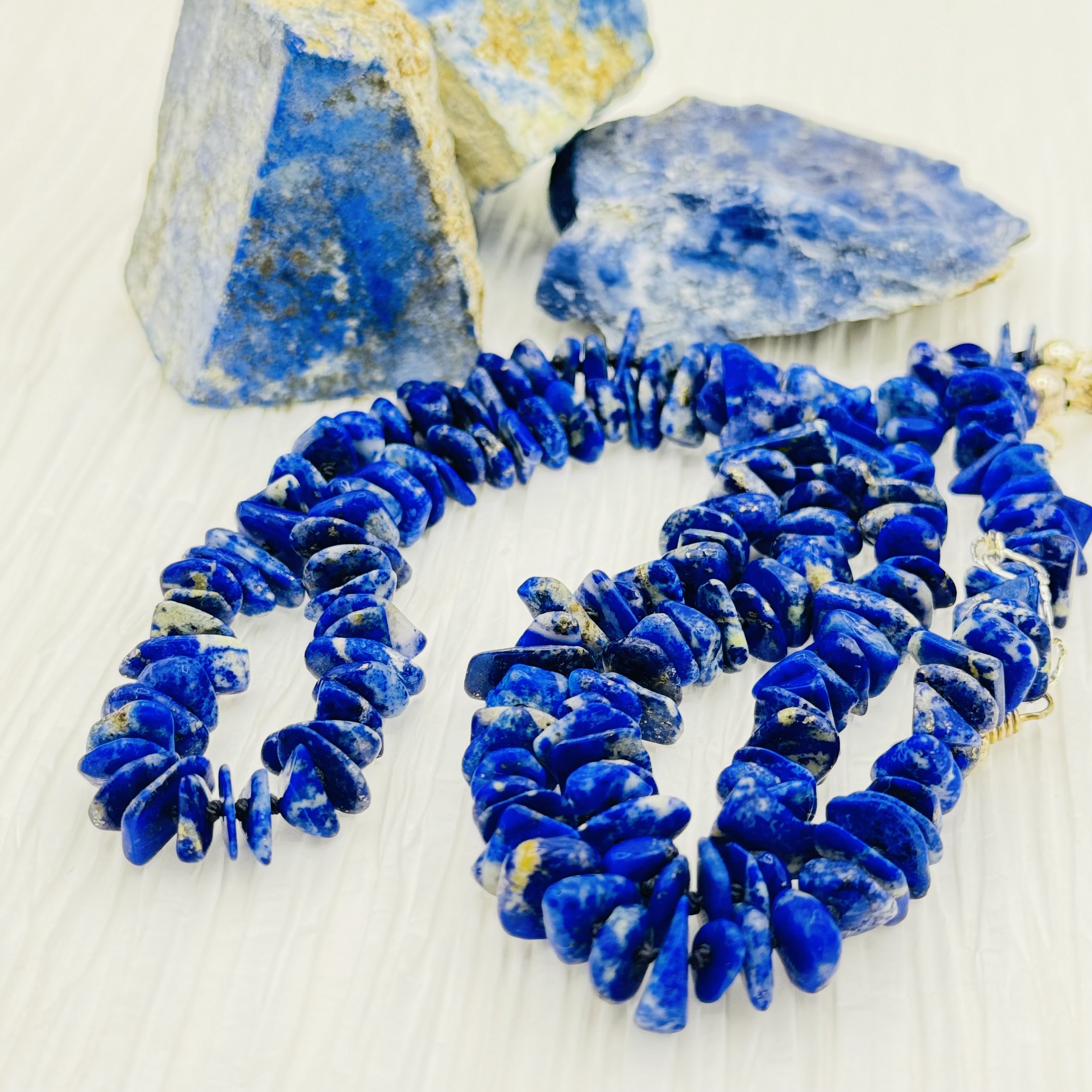 Lapis flat gemstone are hand knotted to create this handmade necklace strand.