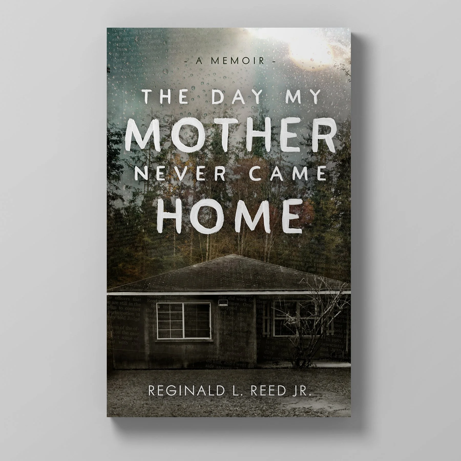 Book cover titled "The Day My Mother Never Came Home" by Reginald L. Reed Jr., featuring a house in a forested background with a gray and white color scheme.