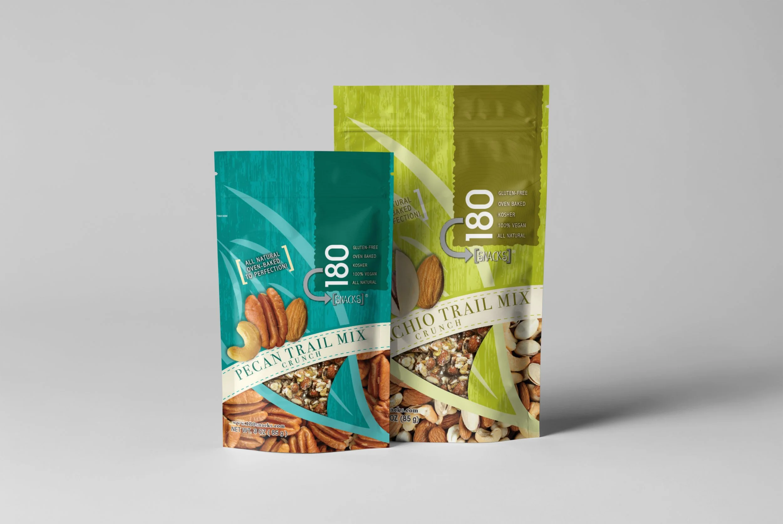 Two packages of trail mix snacks, one labeled 'Pecan Trail Mix Crunch' and the other 'Chio Trail Mix Crunch', placed on a light gray background.
