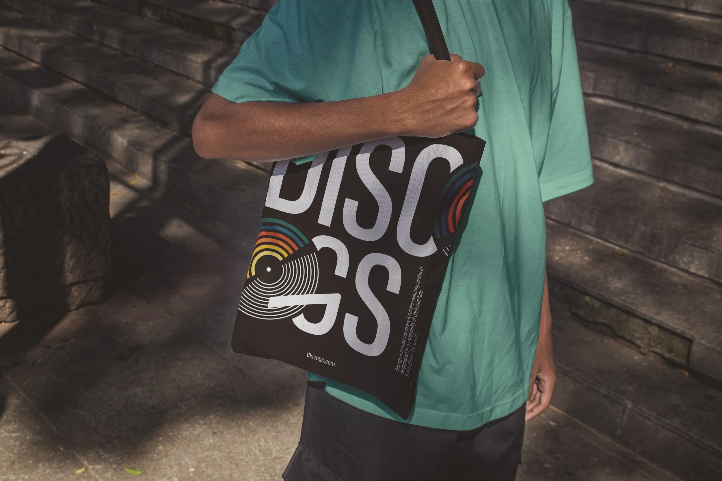  Discogs logo merchandise concept on a black canvas record tote bag designed by twolineSTUDIO.