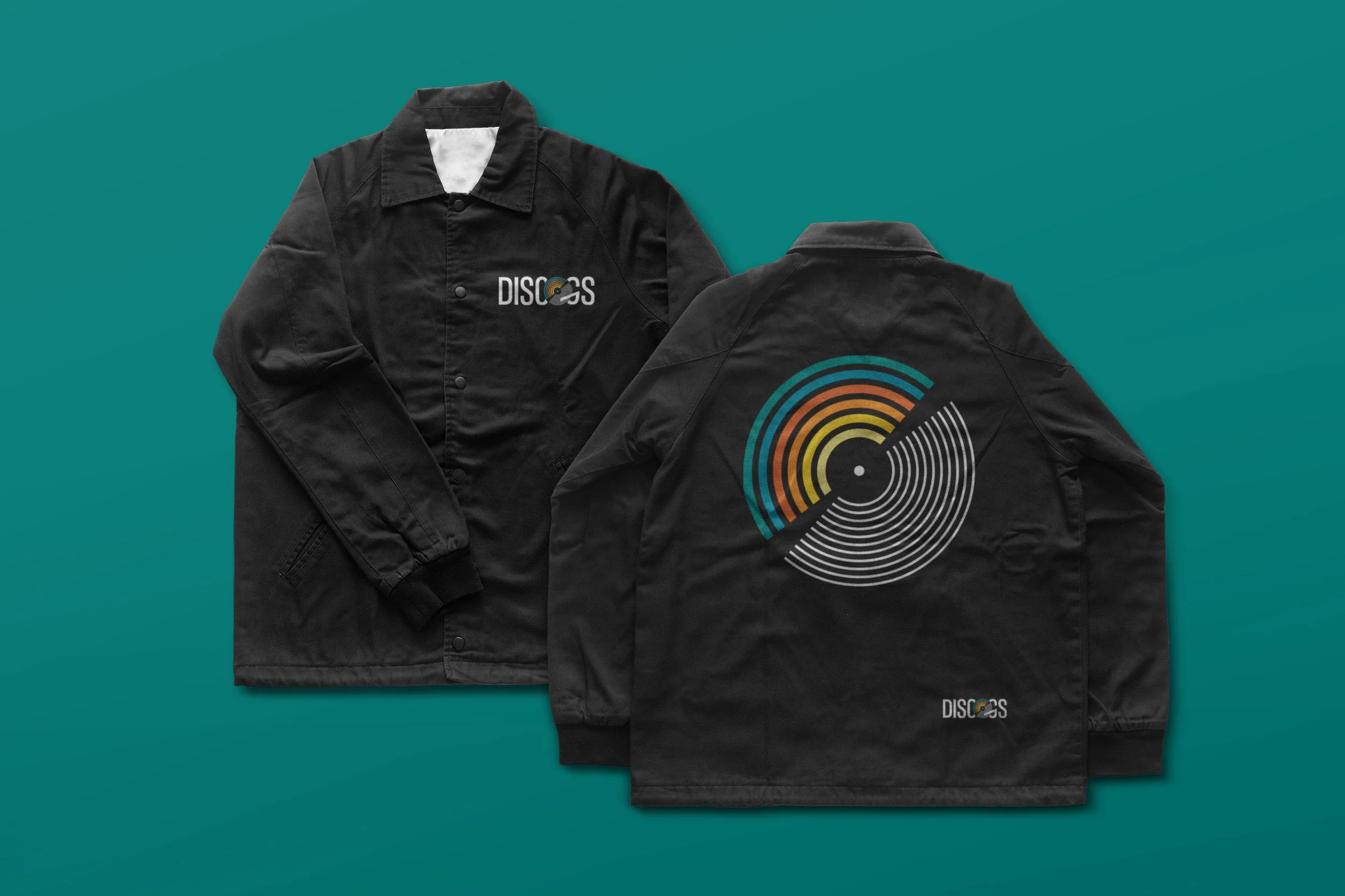 Custom black coach jacket streetwear merchandise showing front embroidery and back vinyl record graphic print for Discogs branding concept.