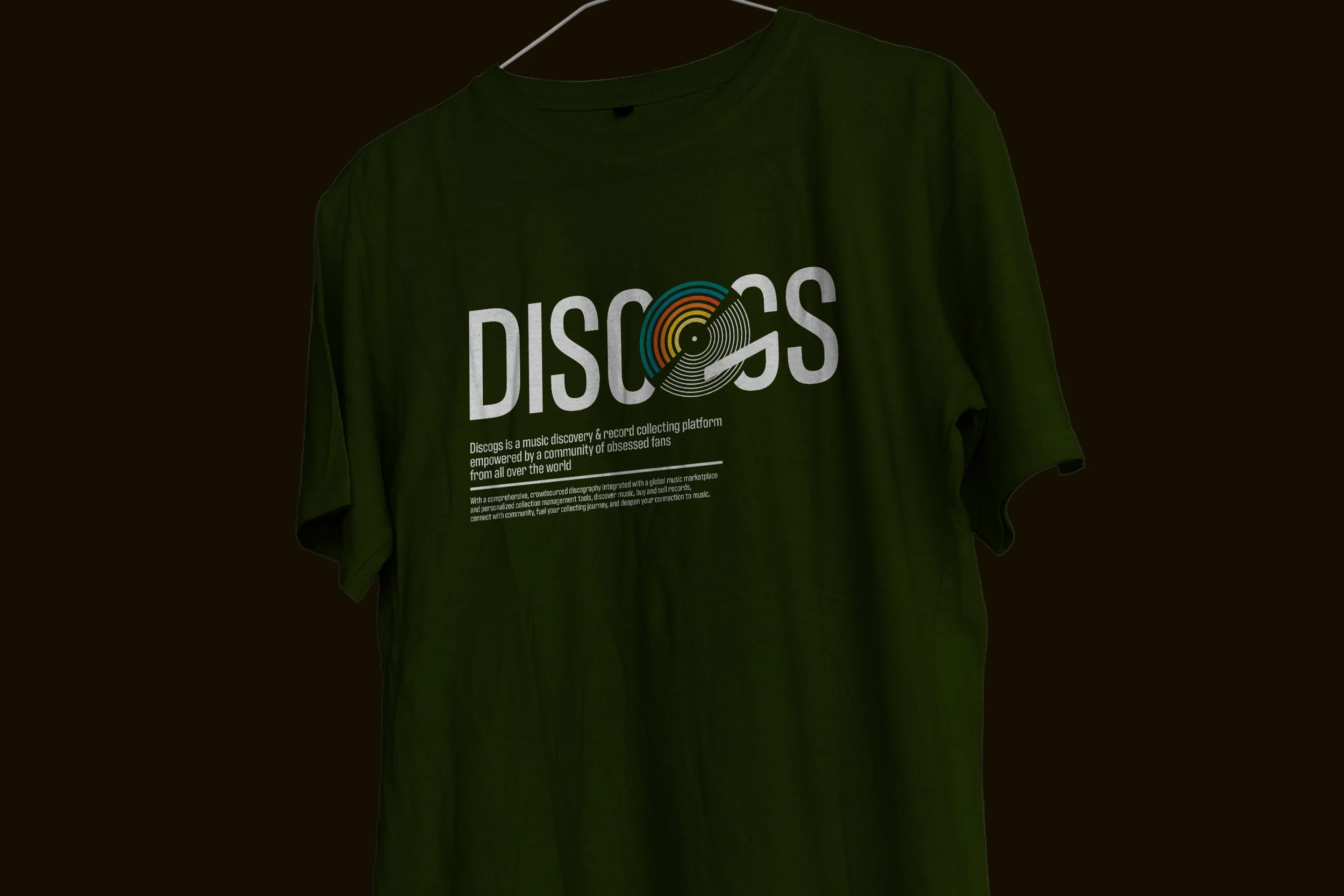Minimalist olive green graphic t-shirt apparel design featuring updated Discogs brand typography and hi-fi color palette.