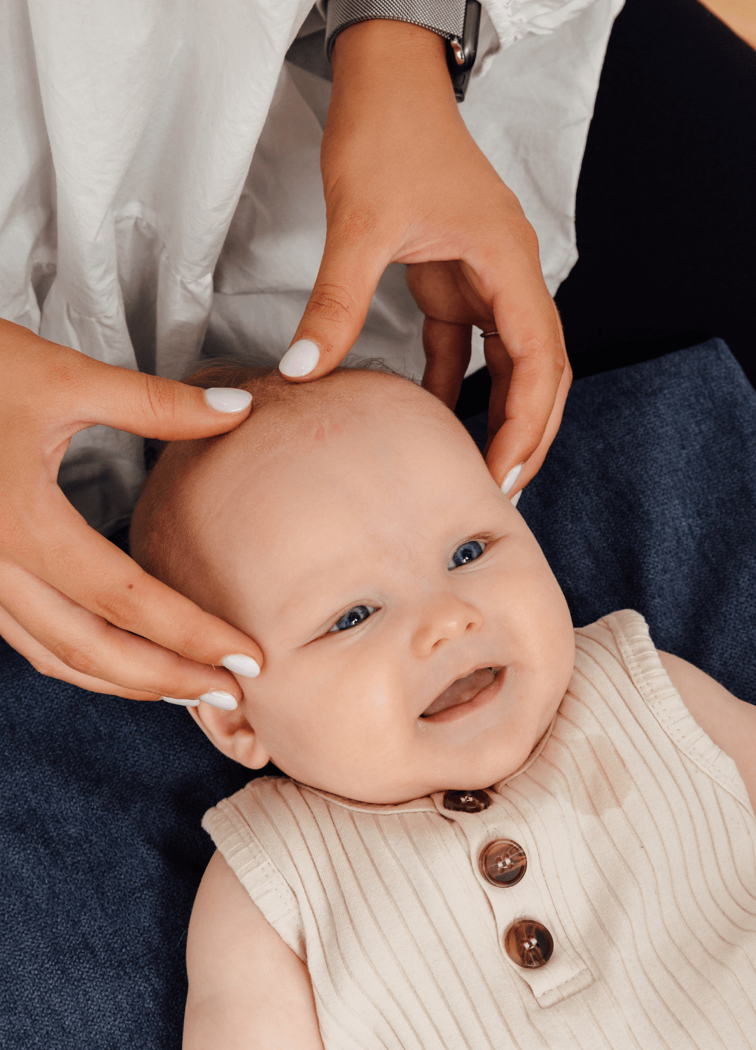 Georgia Lowe working on a baby in clinic