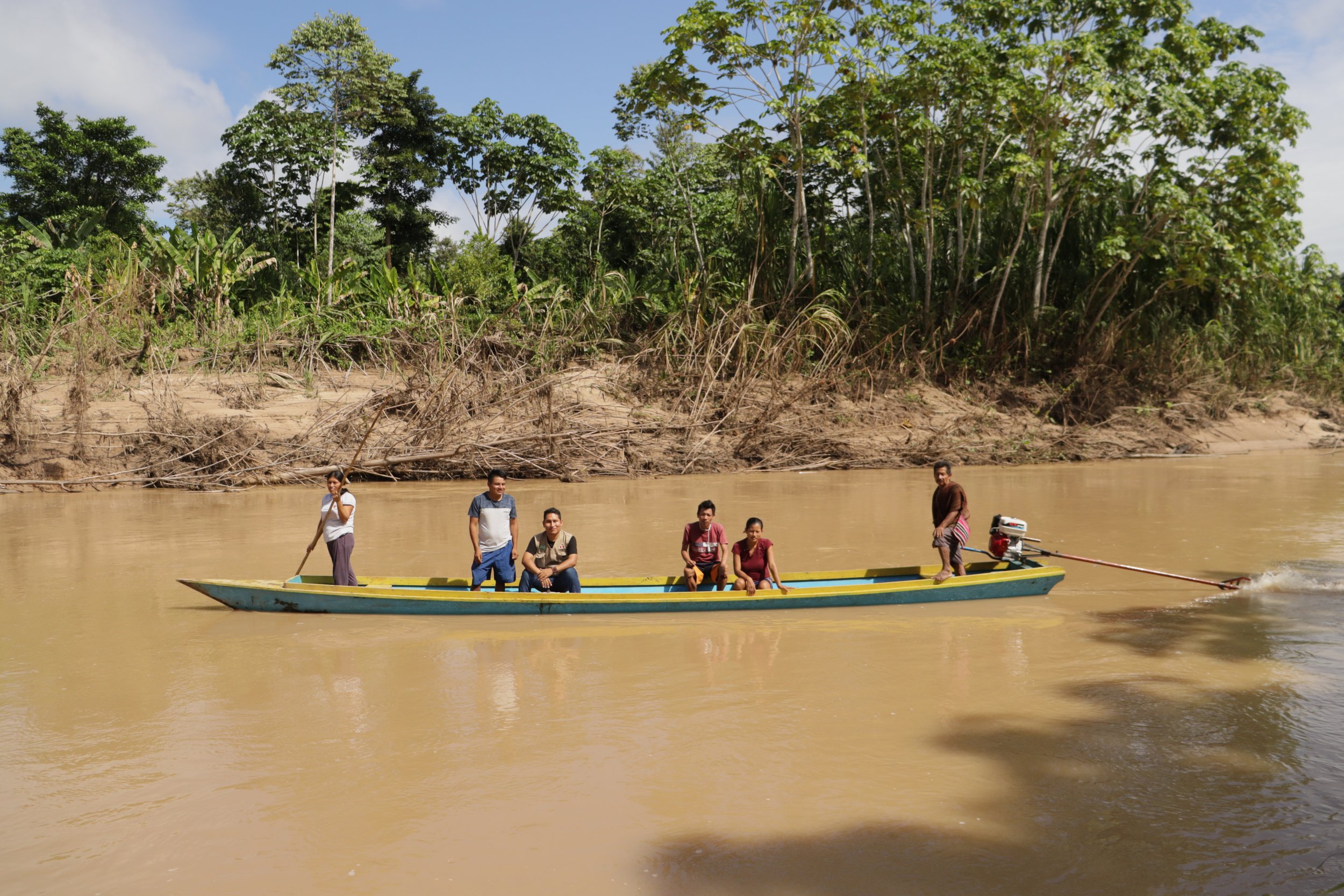  Members of the Saweto vigilance committee using its new boat and motor.  