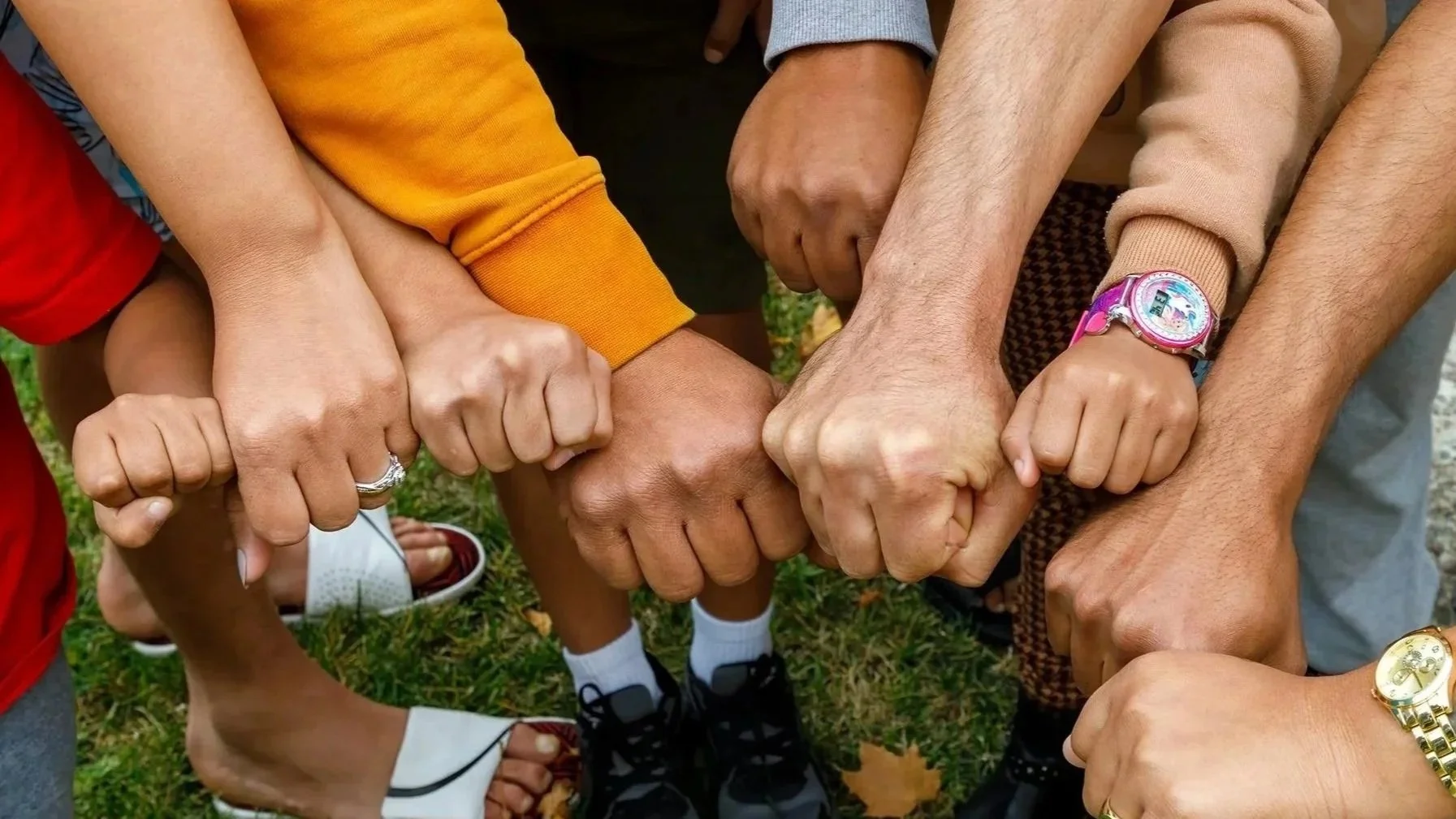Hands together making fists, image by Bob Paulus