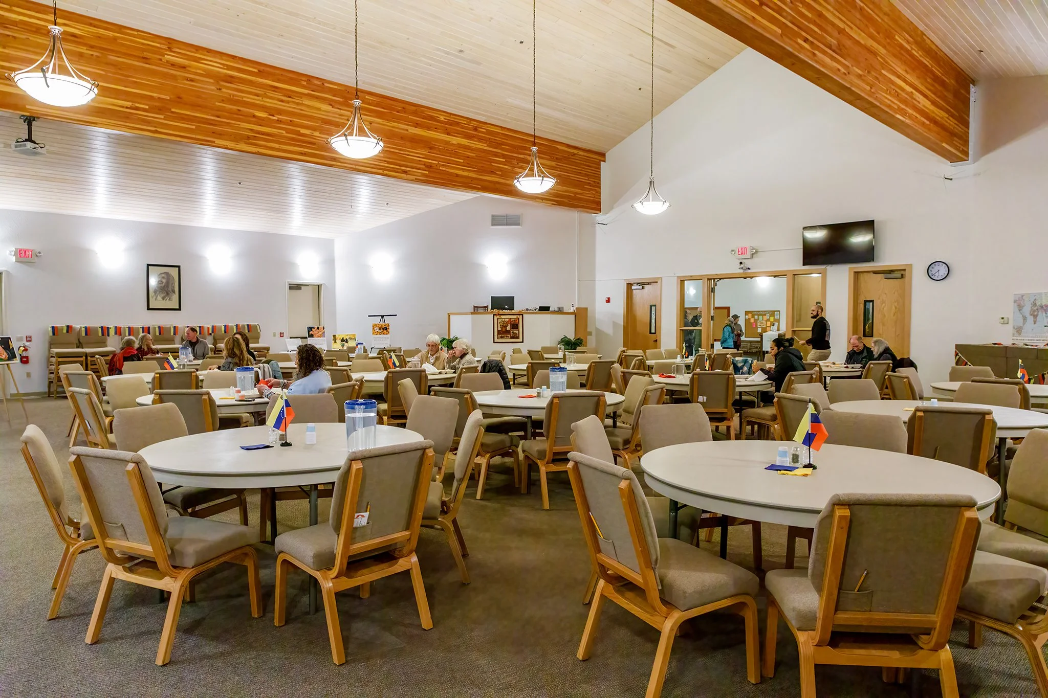 Empty chairs and tables at dinner in communal gathering space