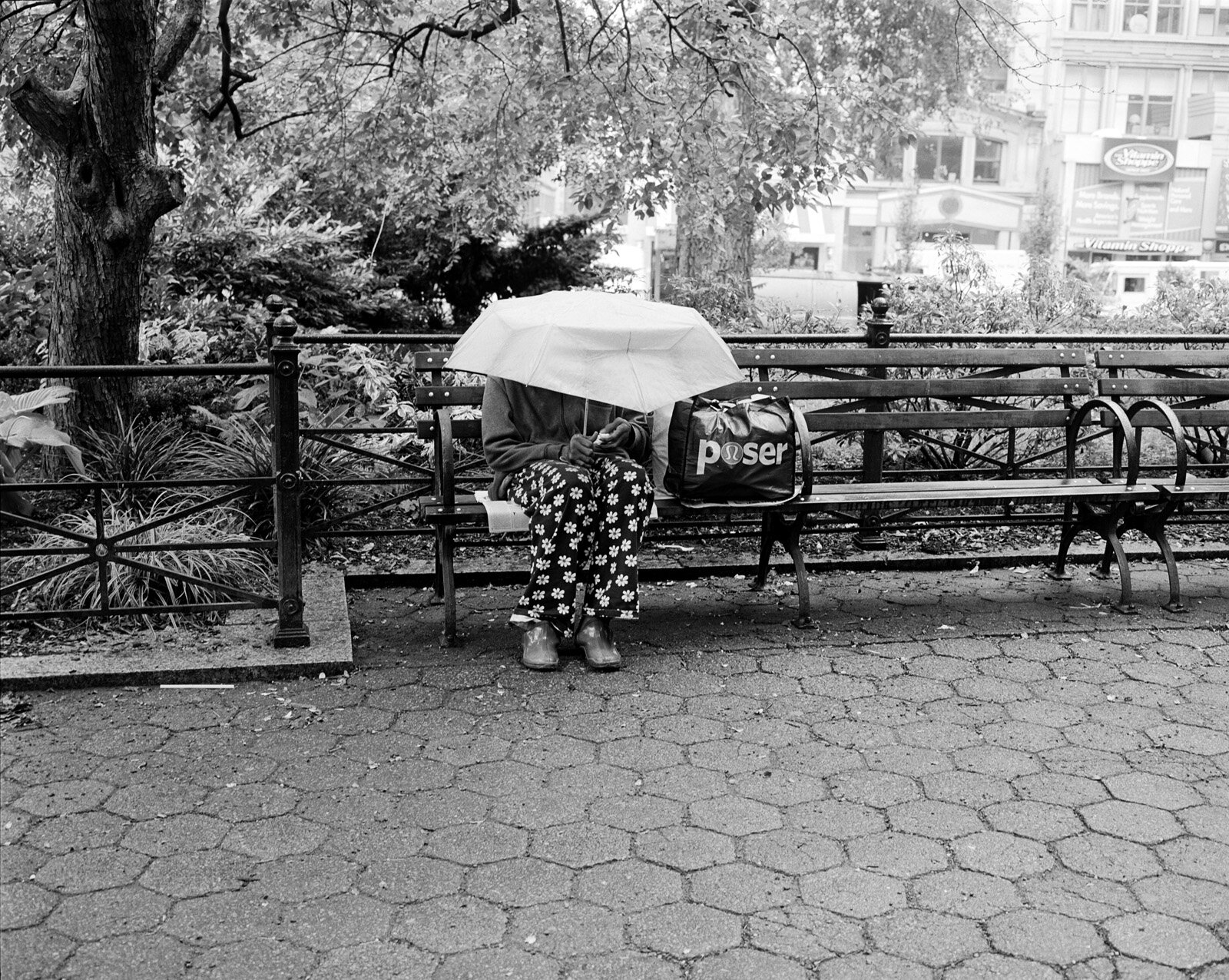 Woman with umbrella, Union Square, New York City