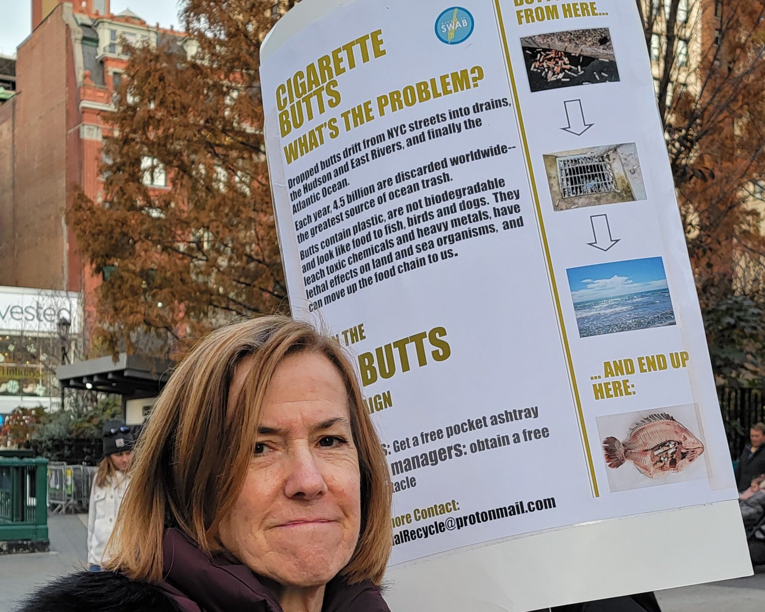   On 14th Street Katie Hanner with the poster used for NO BUTTS tour  