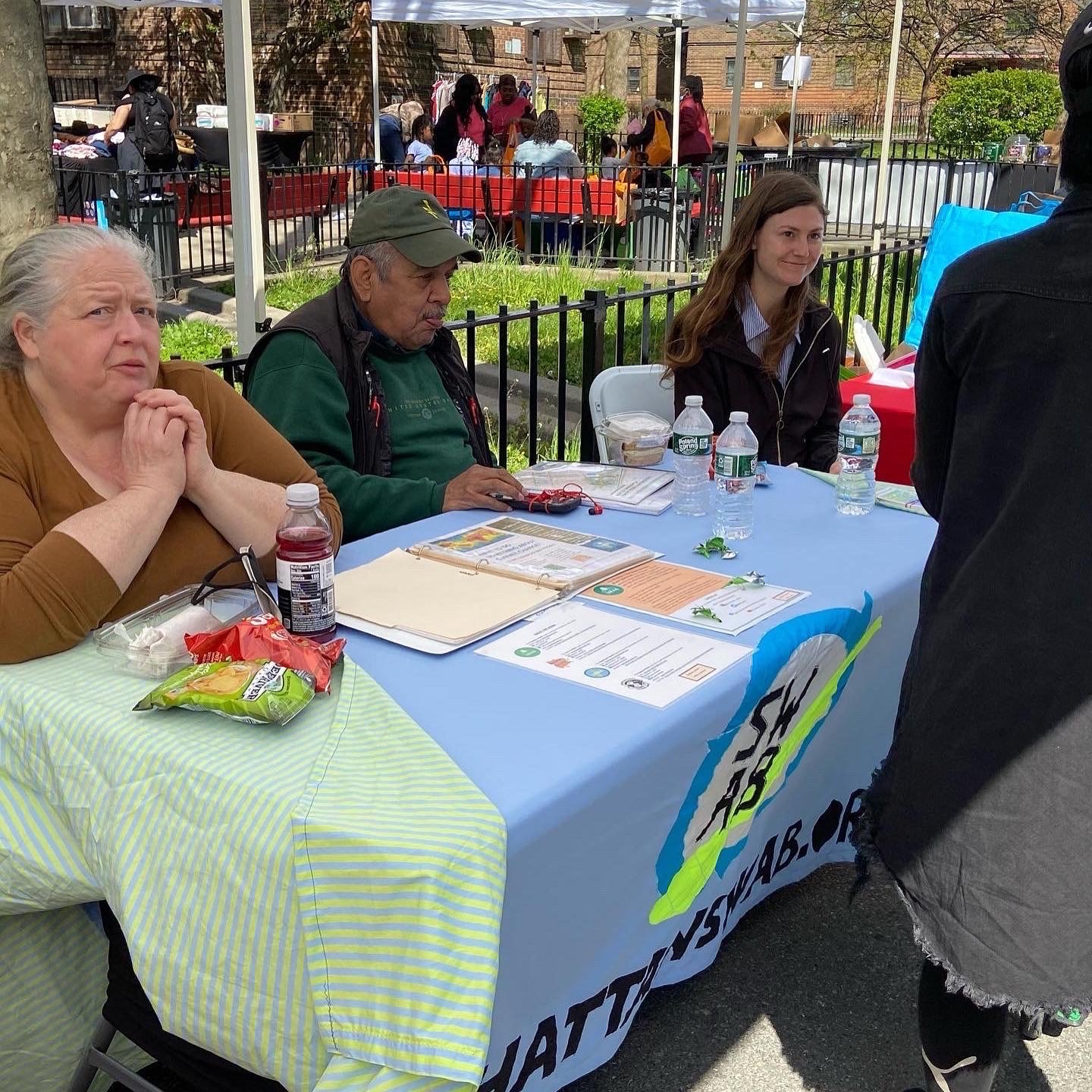   Manhattan and Brooklyn SWAB members talk with NYCHA residents about the NYCHA Recycling Committee  