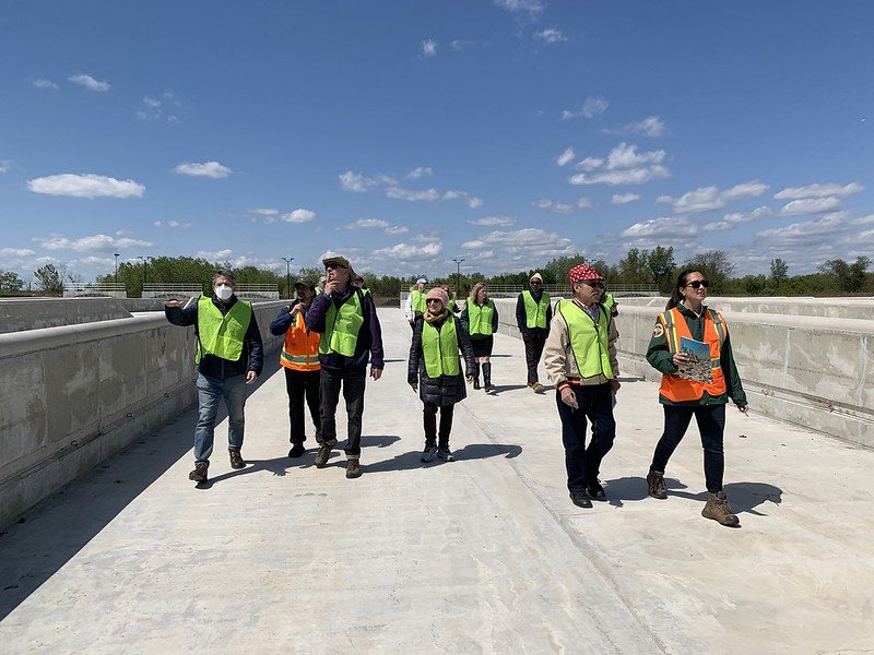   Members walk one of sixteen of the newly constructed aerated static pile (ASP) composting bays designed by    Sustainable Generation    to increase capacity and improve processing efficiency.   (Photo credit: Aline Reynolds) 