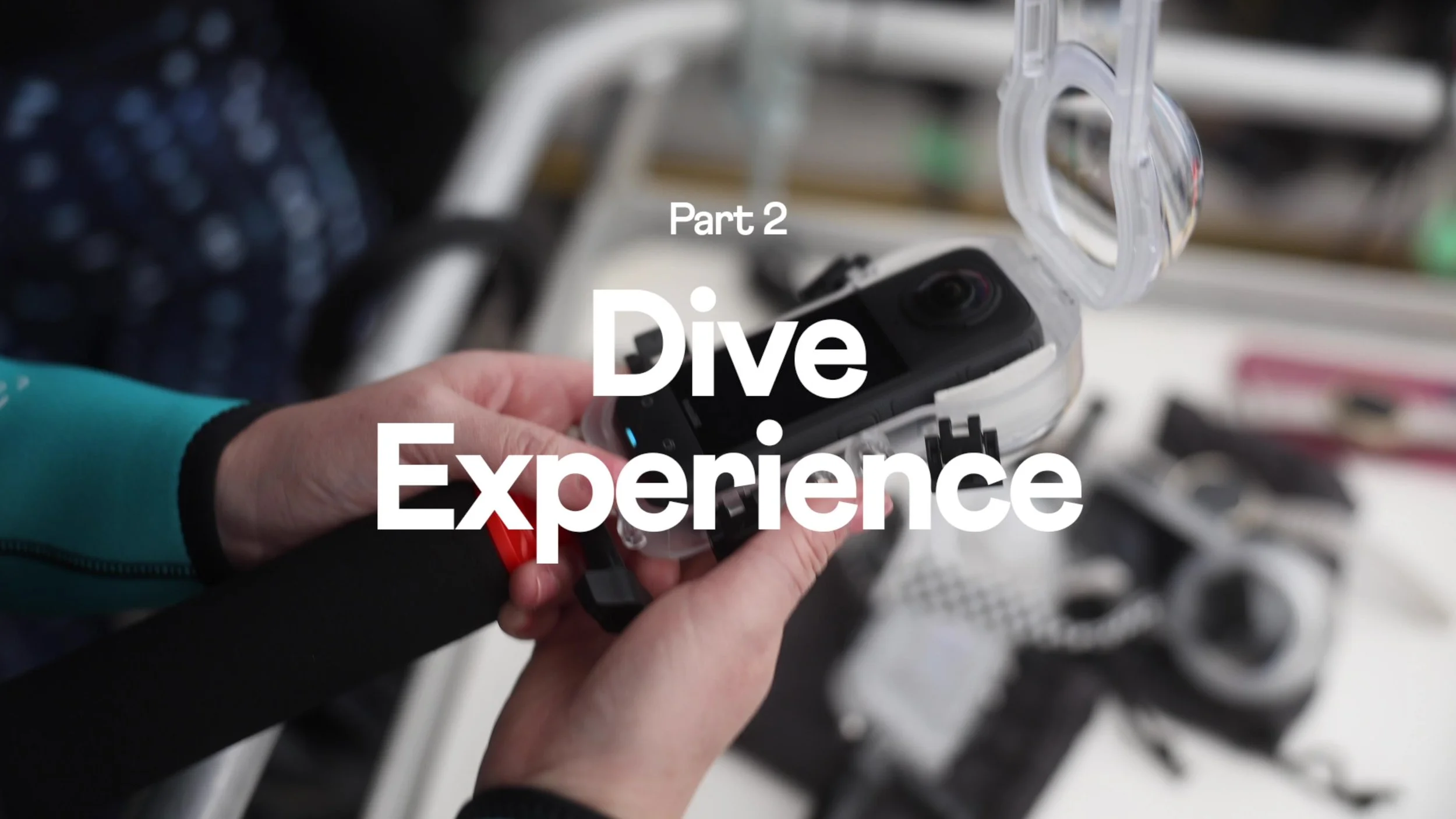 Close-up of a person holding a waterproof case for a camera or phone, with the lid open, with bicycle-related items in the background.