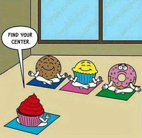 A group of cartoon pastries is at a yoga class. The teacher tells the class to "find your center." The cookie and the muffin smile with their eyes closed. The donut stares into the abyss with dread.