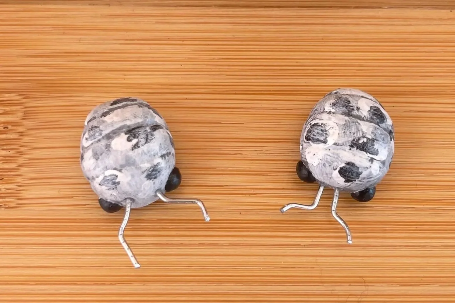 Cow Isopods - Made with leftover epoxy resin, painted with acrylics, bead eyes and wire antennae, coated in polyurethane finish