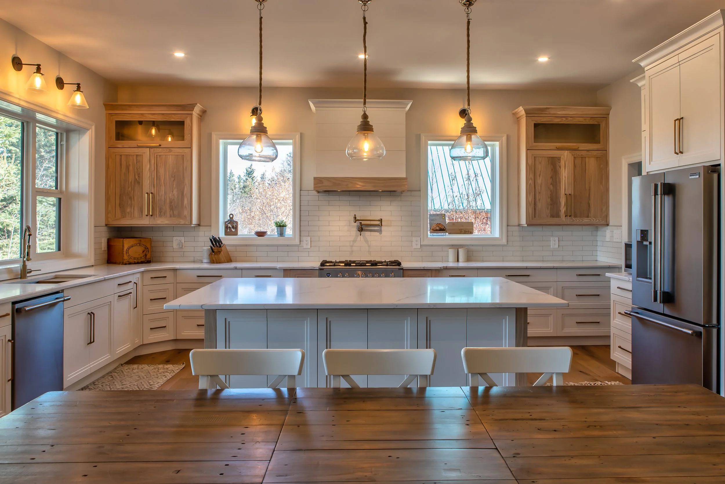 white kitchen with blonde wood accent cabinets