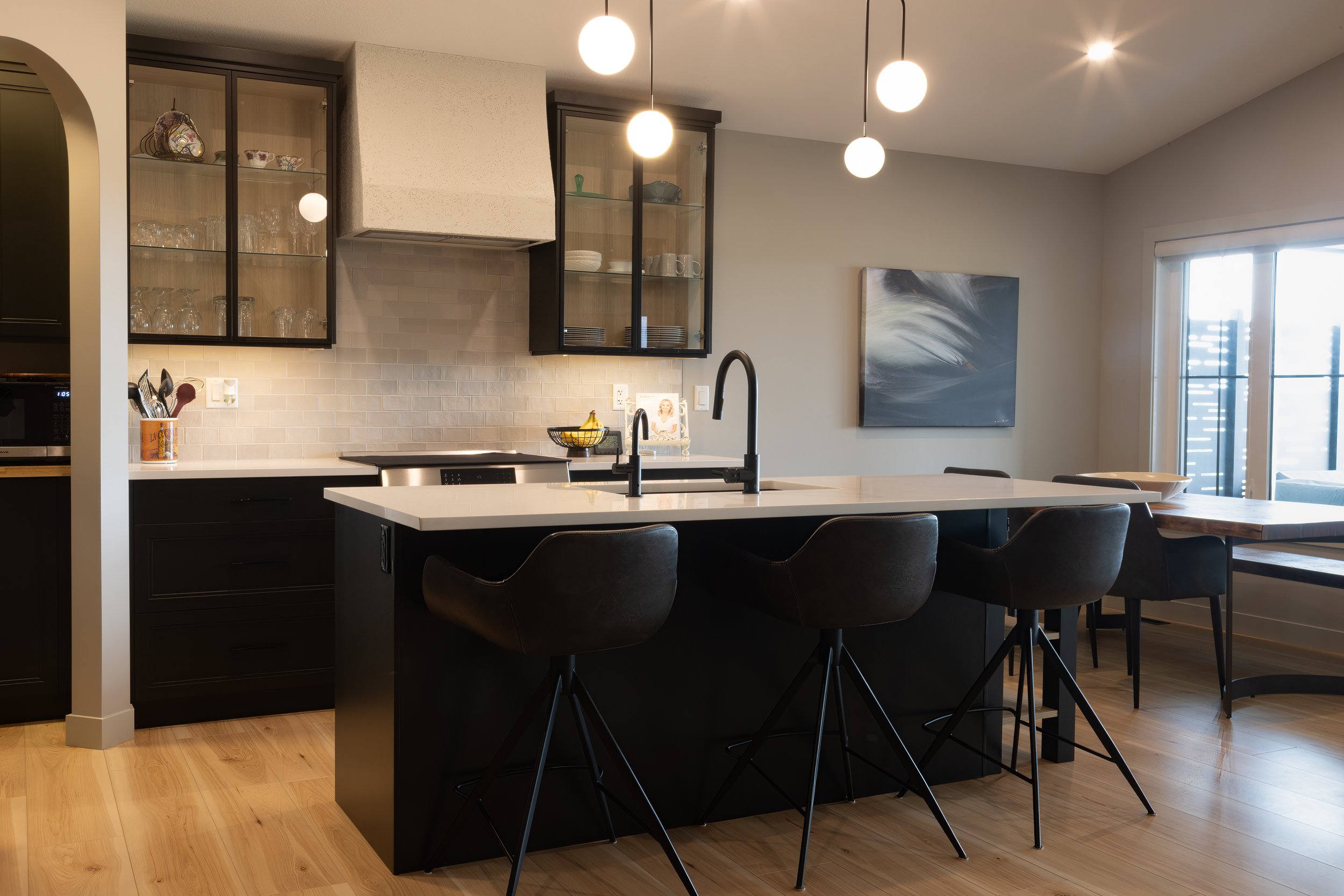 Dark Green cabinets with stucco hood and aluminium glass doors