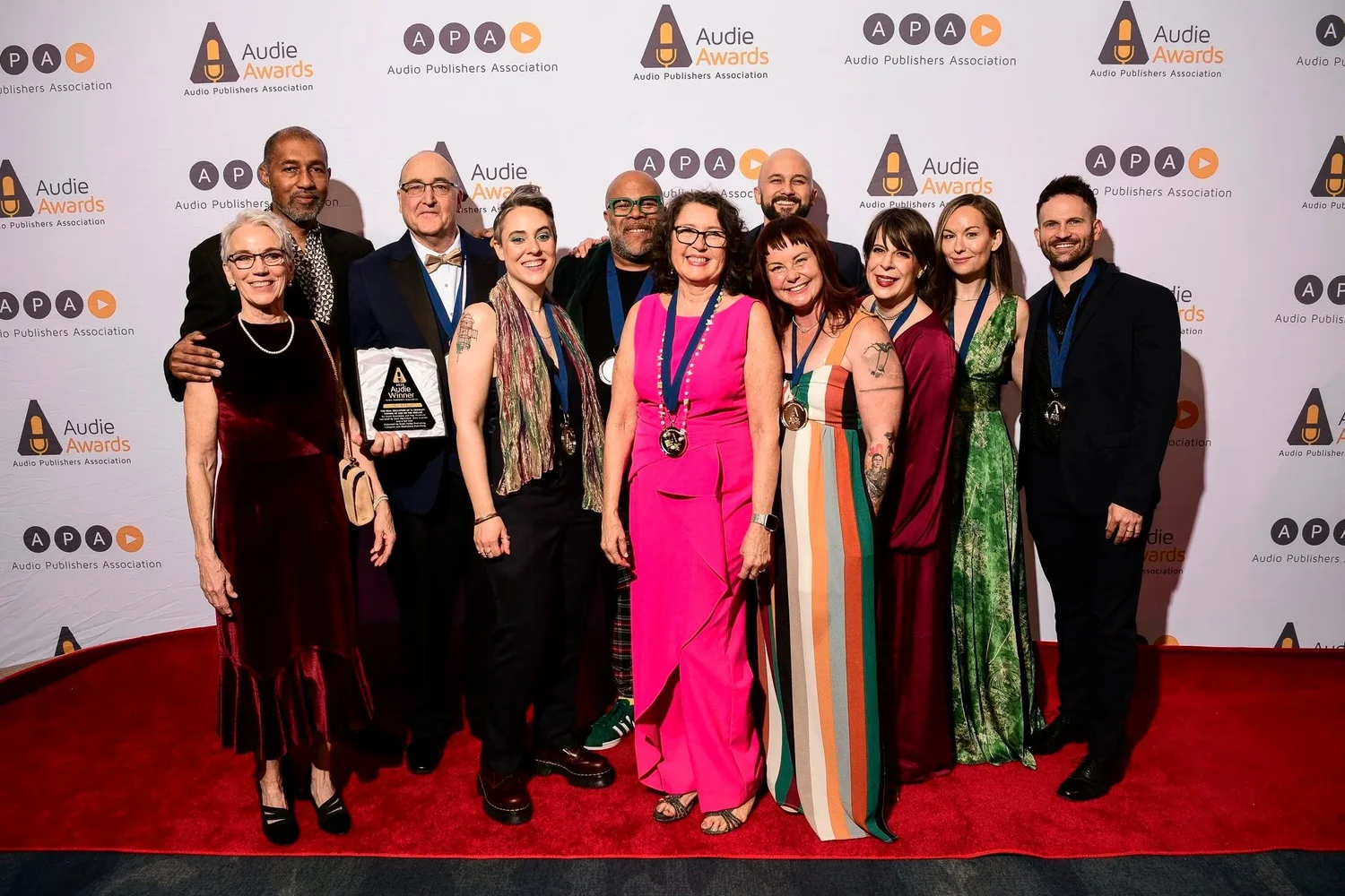 The cast and creative team of The Real Education of TJ Crowley on the red carpet at the 2025 Audie Awards.