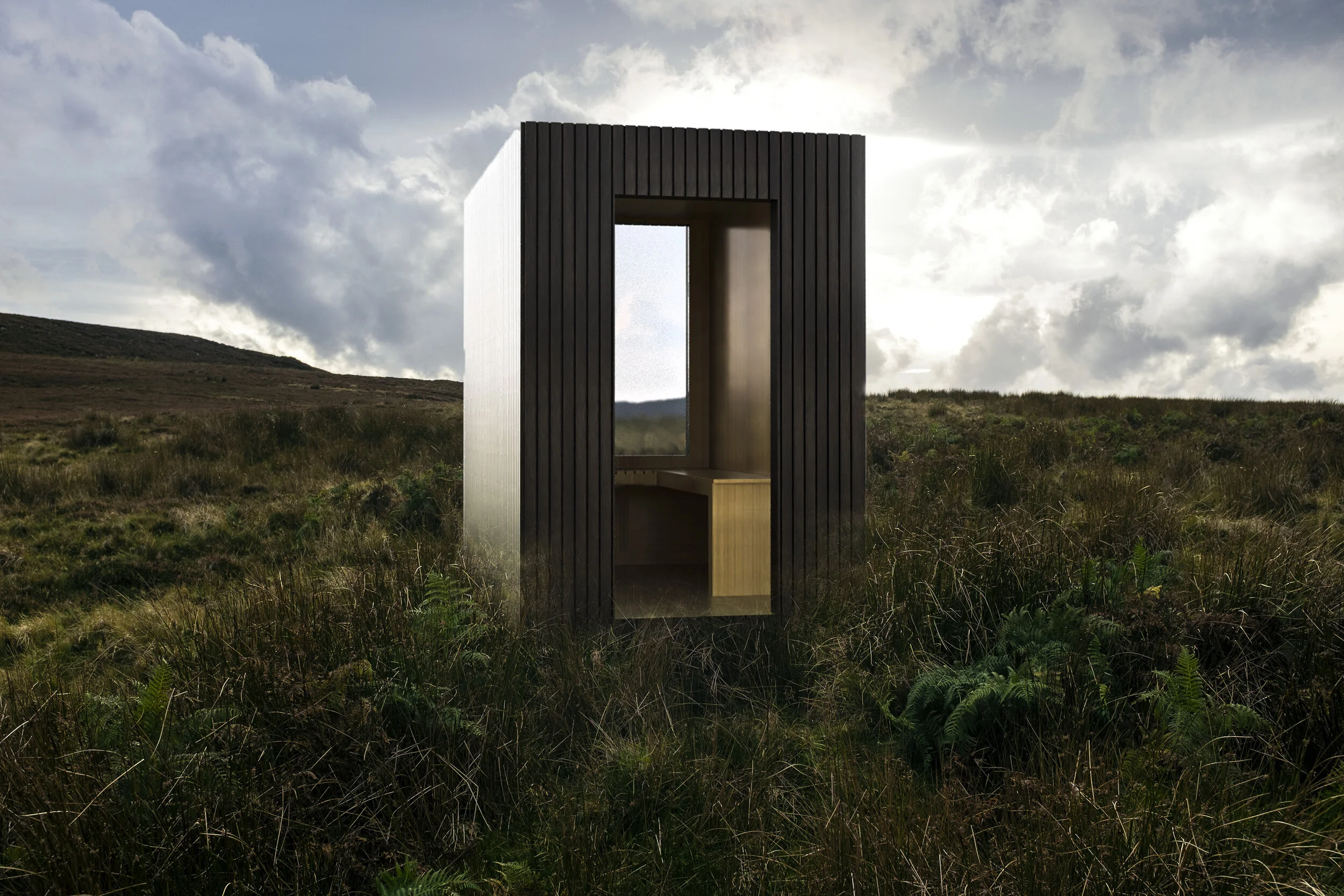 A small wooden shelter with open sides in a grassy field under a cloudy sky.