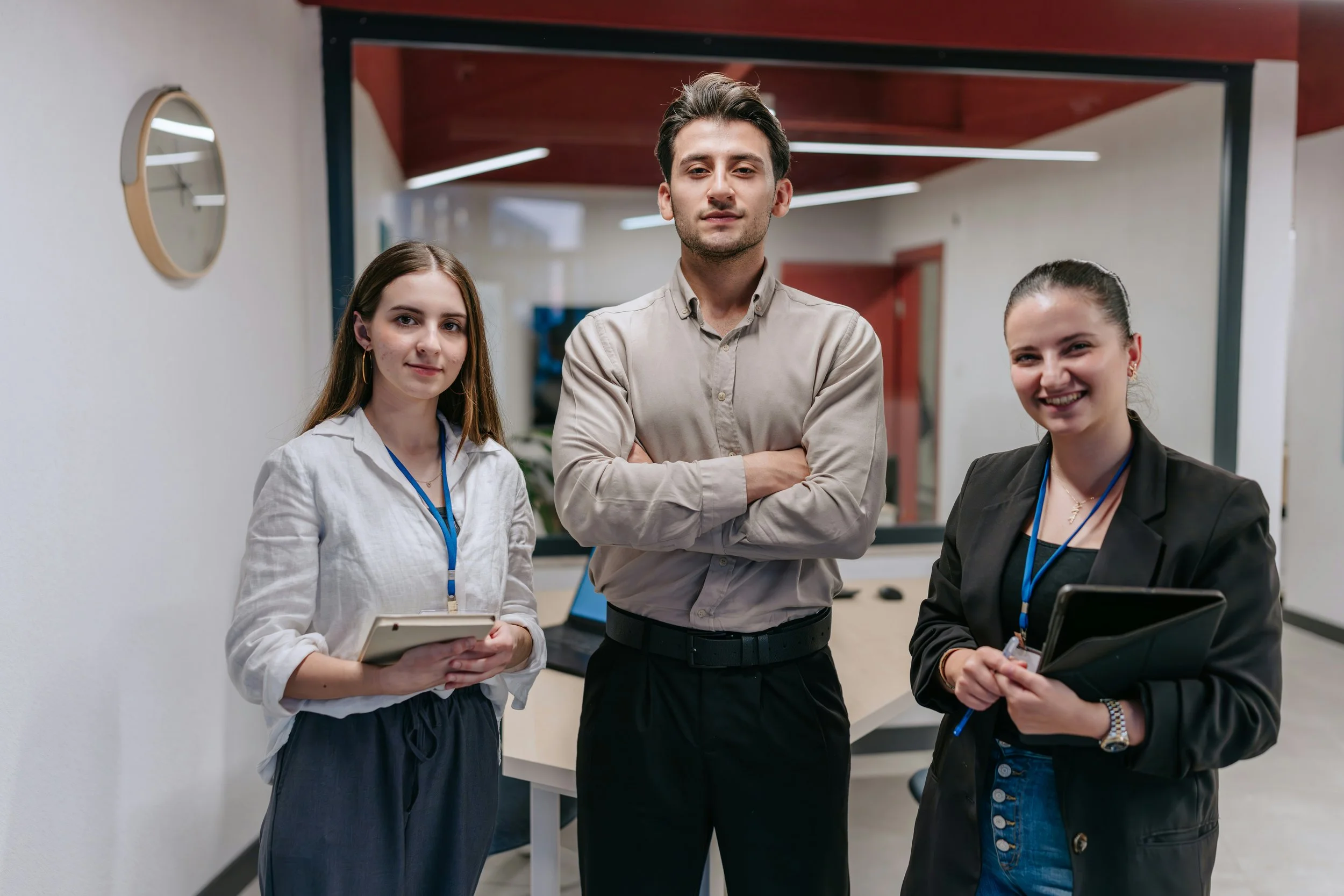 Three educators in a school building office