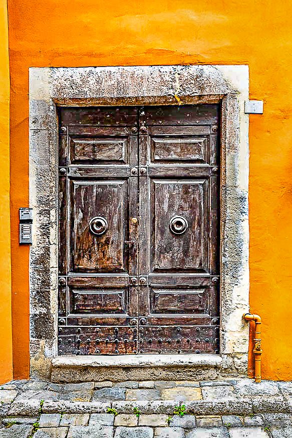 Wood door in an Orange Wall