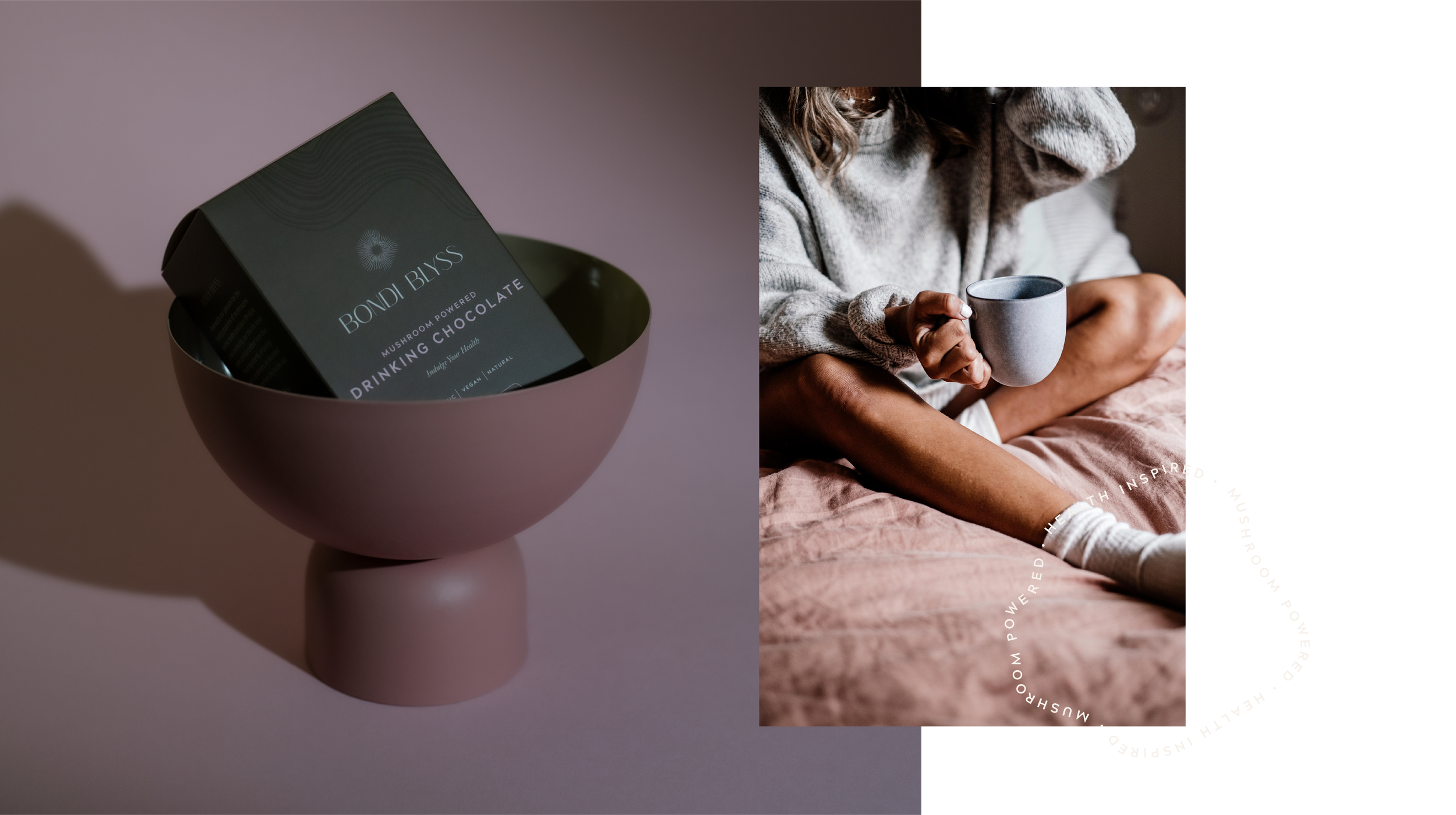 A pink bowl with a packet of Bondi Bliss mushroom-powered drinking chocolate inside, and a person sitting on a bed holding a gray mug, wearing a cozy gray sweater and white socks.