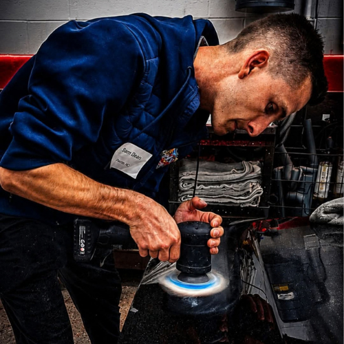 Sam polishing a vehicle
