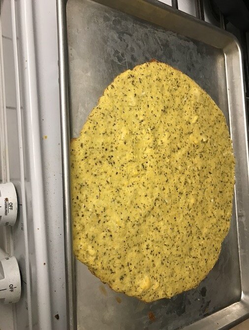 Cauliflower pizza in pan