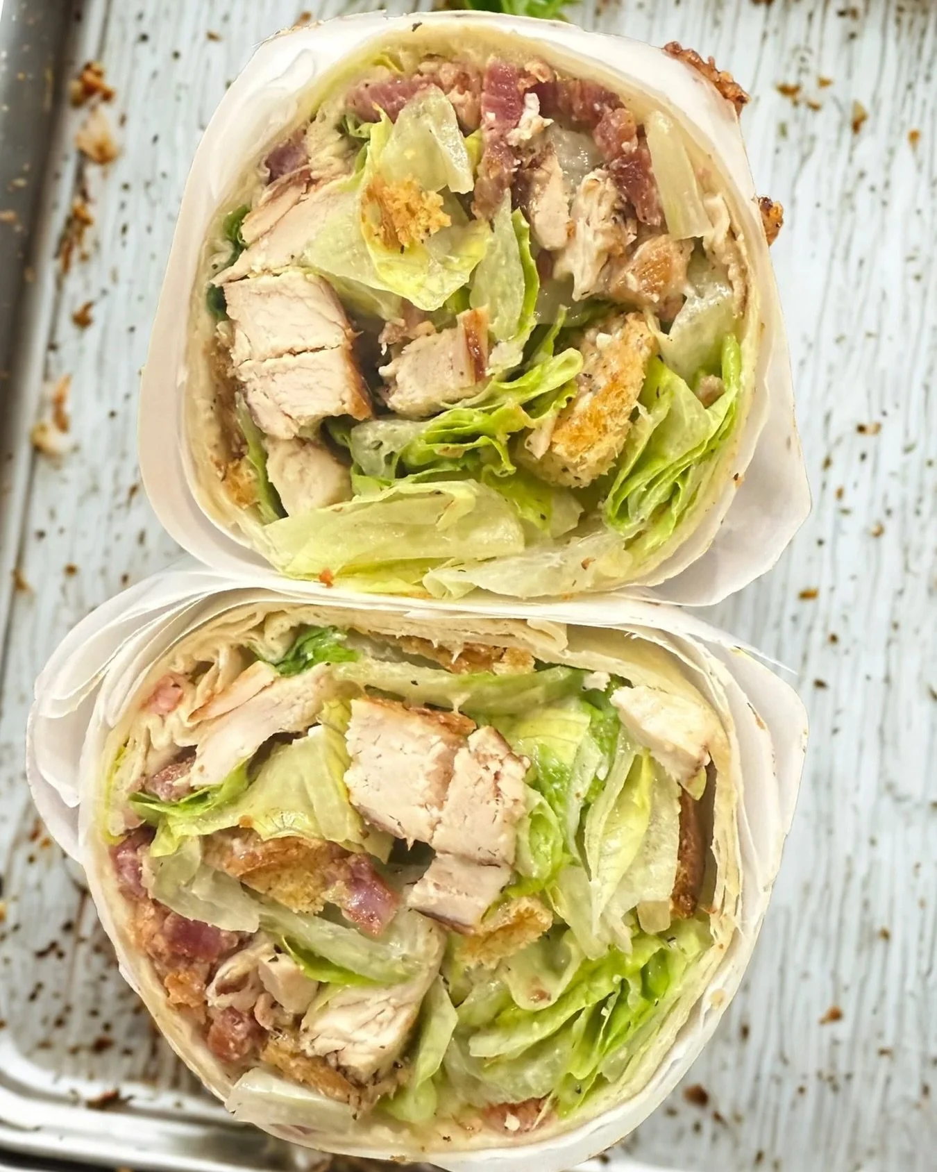 🥗🔥 Say hello to the Crackin&rsquo; Caesar Wrap &mdash; our latest handheld beast. We&rsquo;ve loaded it up with:
✨ Chopped romaine lettuce
✨ Grilled chicken fillet
✨ Our house-smoked Crackin&rsquo; bacon
✨ Parmesan cheese
✨ Seasoned croutons
✨ Cand