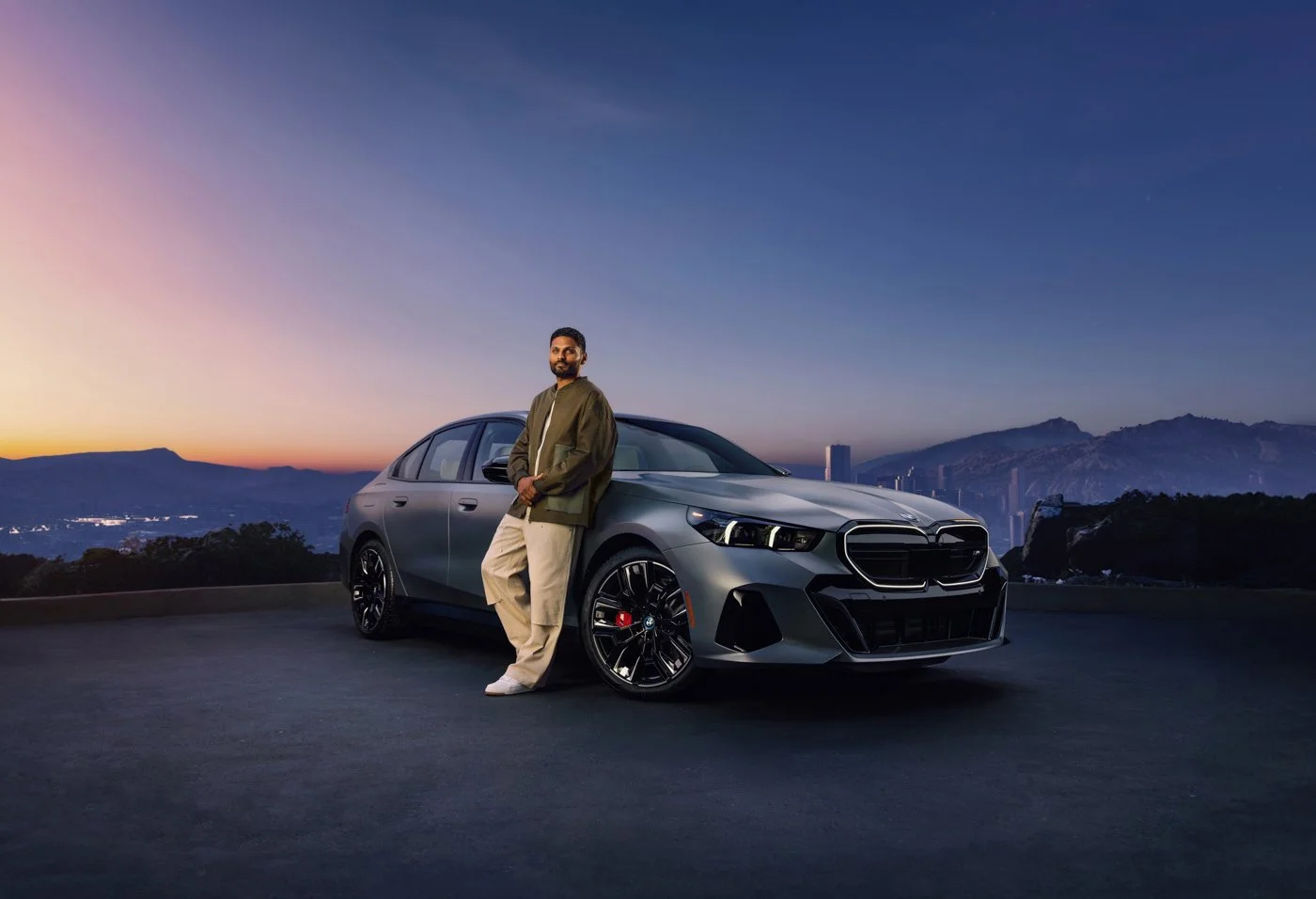 Celebrity speaker and influencer Jay Shetty featured in BMW commercial photography, blending automotive performance, lifestyle, and cinematic campaign styling.