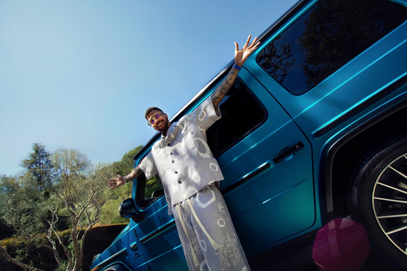 Miles Chamley-Watson poses with a Mercedes-Benz in a luxury automotive advertising campaign photographed by commercial automotive photographer David Masemore.
