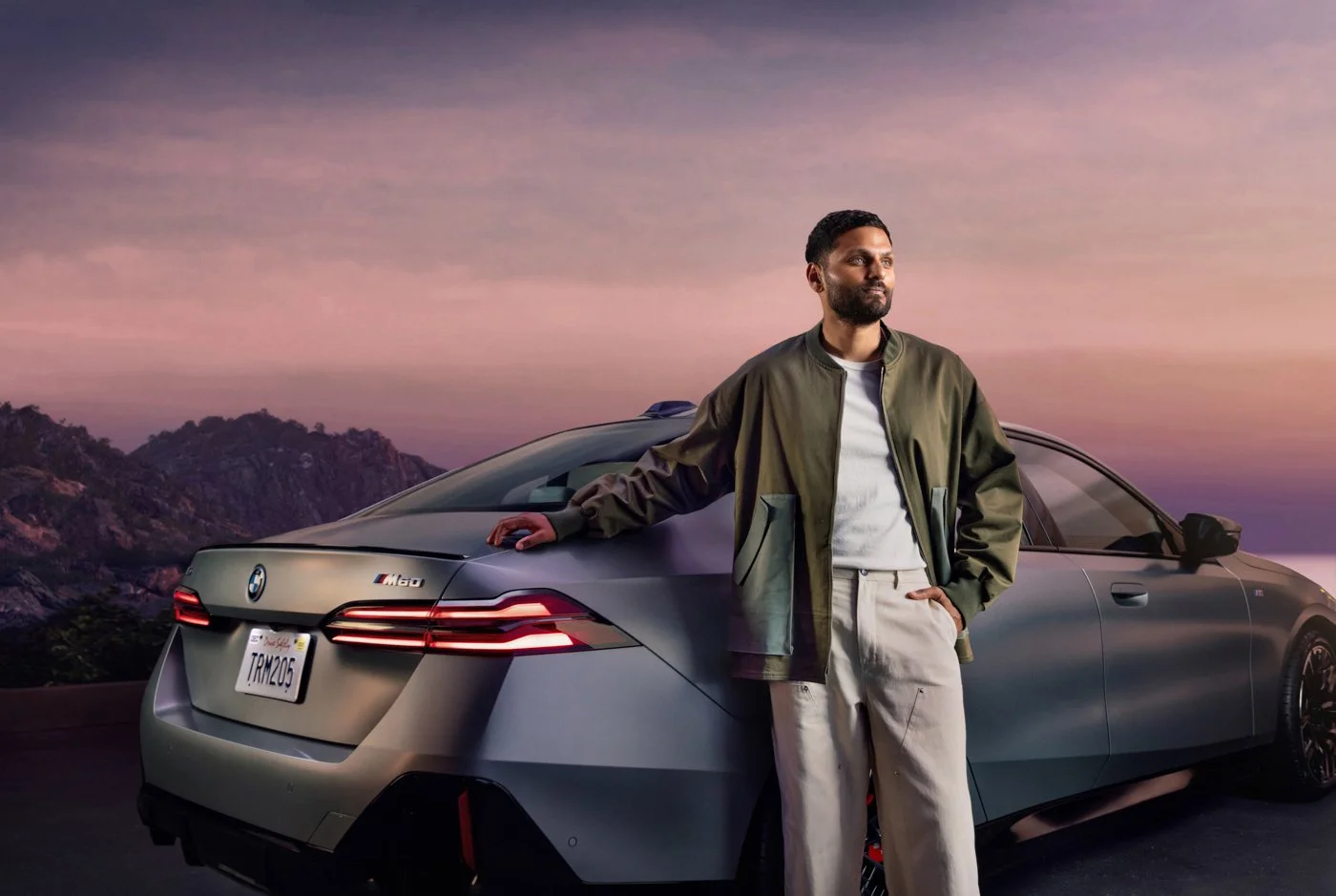 Jay Shetty poses with a BMW in a luxury automotive advertising campaign photographed by commercial automotive photographer David Masemore.