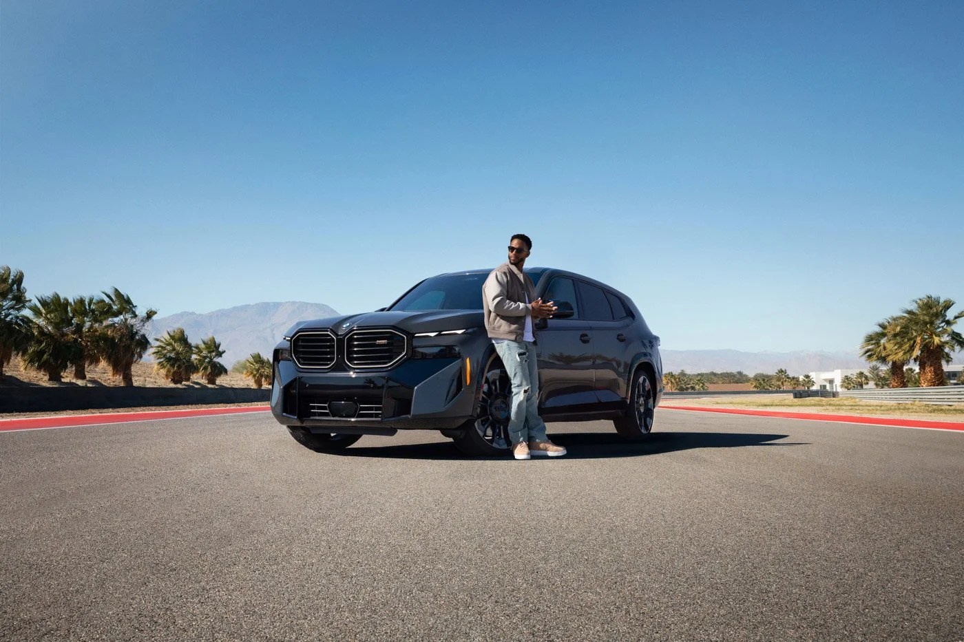 BMW automotive advertising image with Victor Cruz captured in a cinematic commercial campaign highlighting luxury and modern brand sophistication.