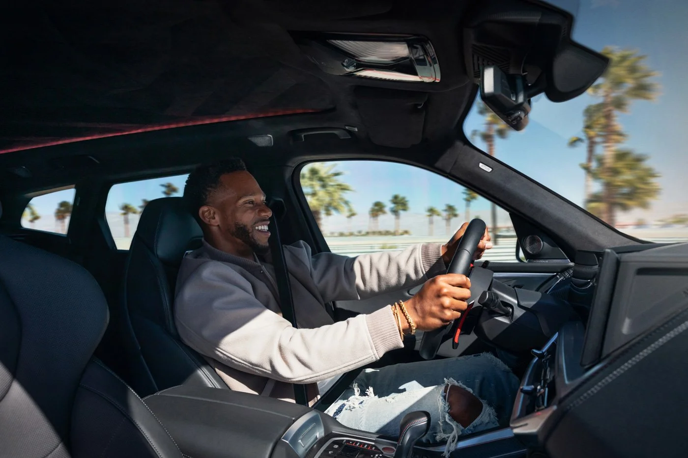 Celebrity athlete Victor Cruz featured in BMW XM commercial photography, blending automotive performance, lifestyle, and fashion-driven campaign imagery.