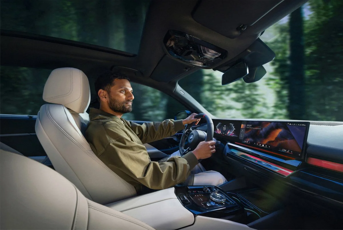 BMW automotive advertising image with Jay Shetty captured in a cinematic commercial campaign highlighting luxury, performance, and modern brand sophistication.