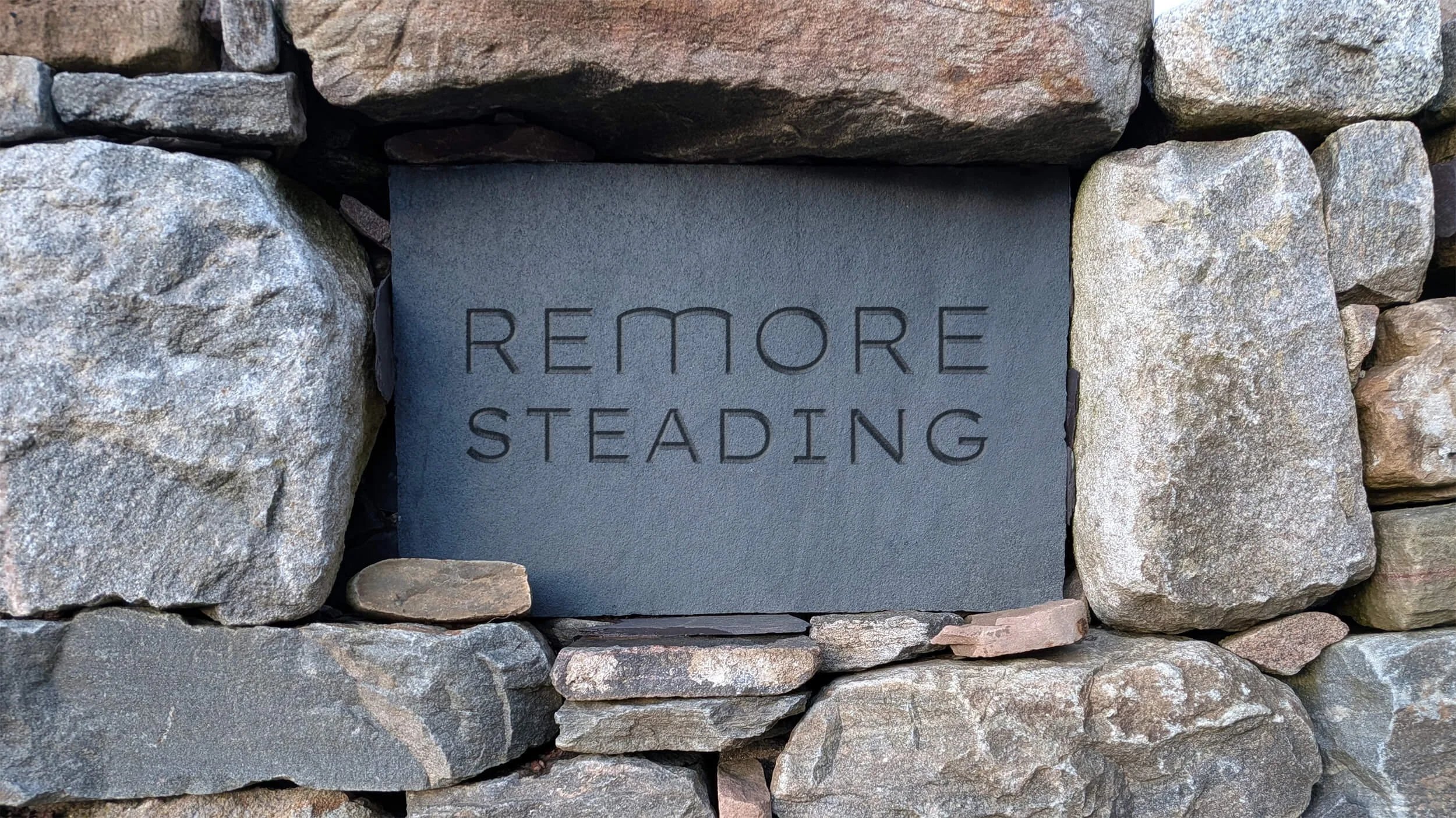 A engraved slate sign for Remore Steading.