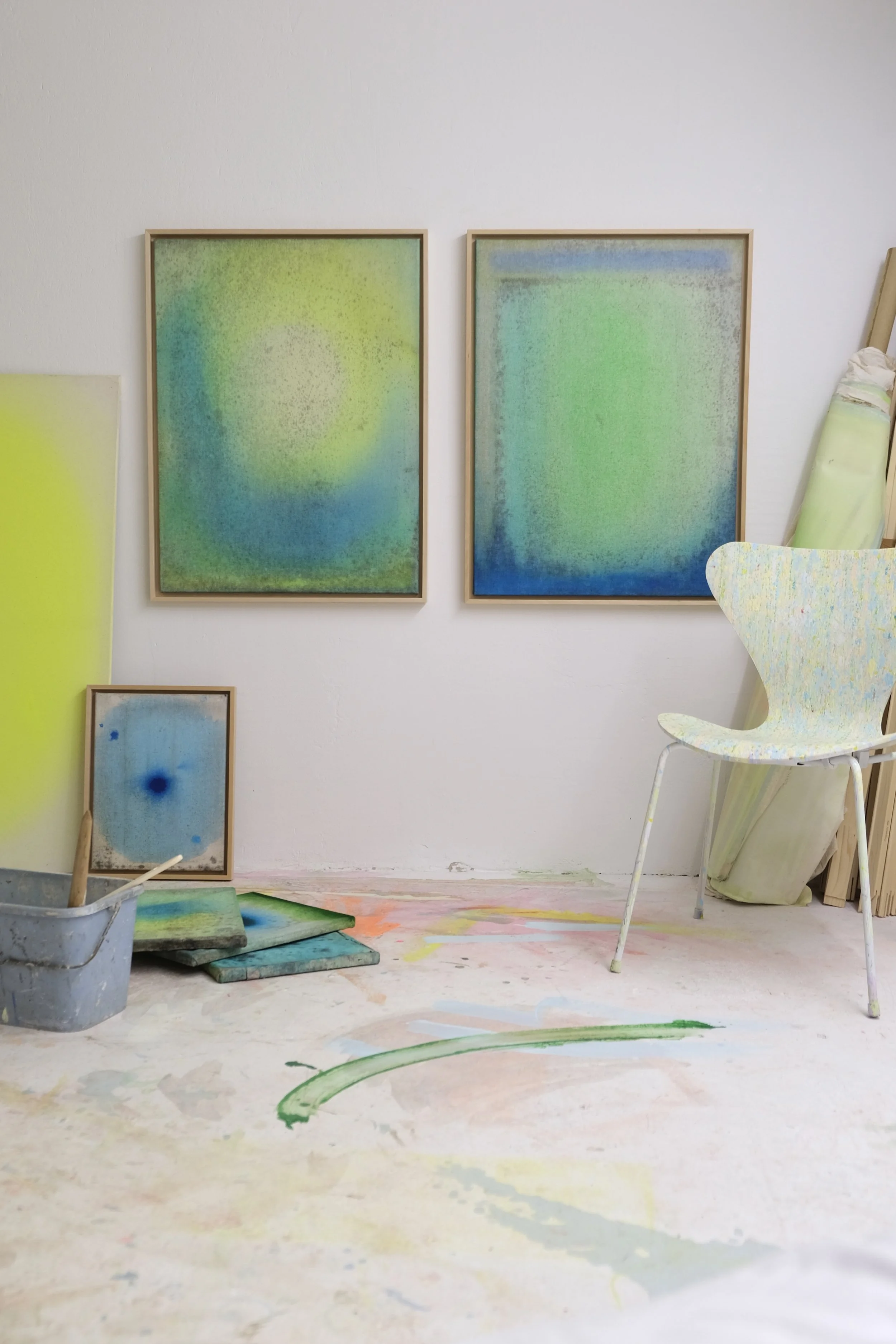 Sorbet Deconstructed by Anastasia Benko hang above a softly arranged space with sculptural furniture, and painterly floor gestures, exploring atmosphere, material erosion, color memory, and spatial perception.