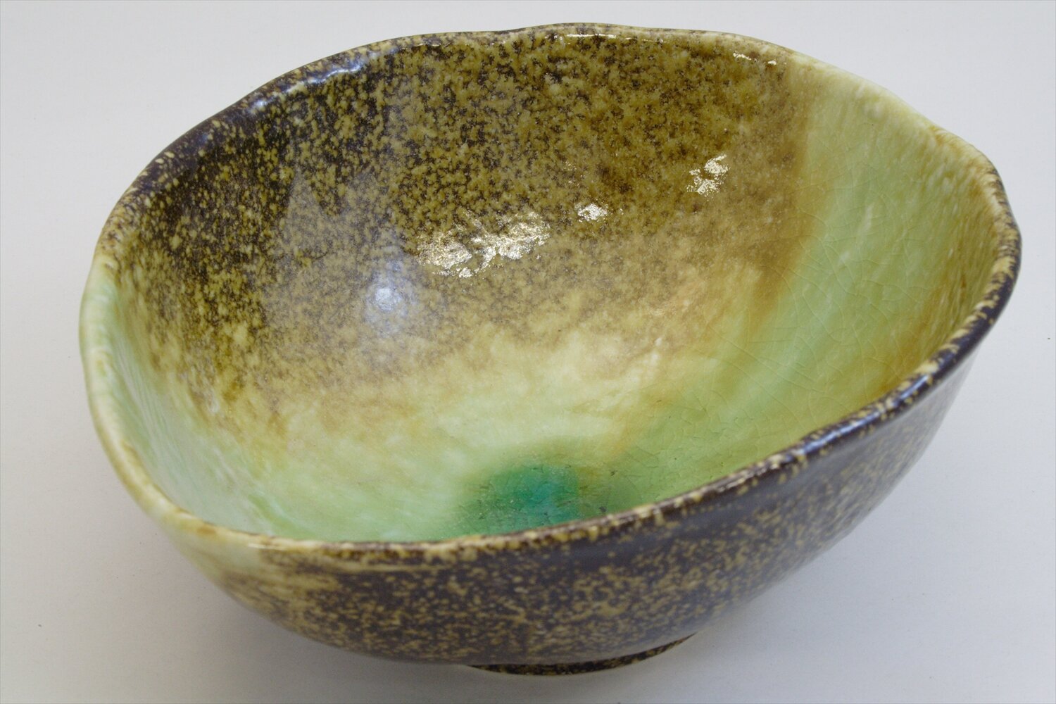 211-0145 Green on brown oval serving bowl