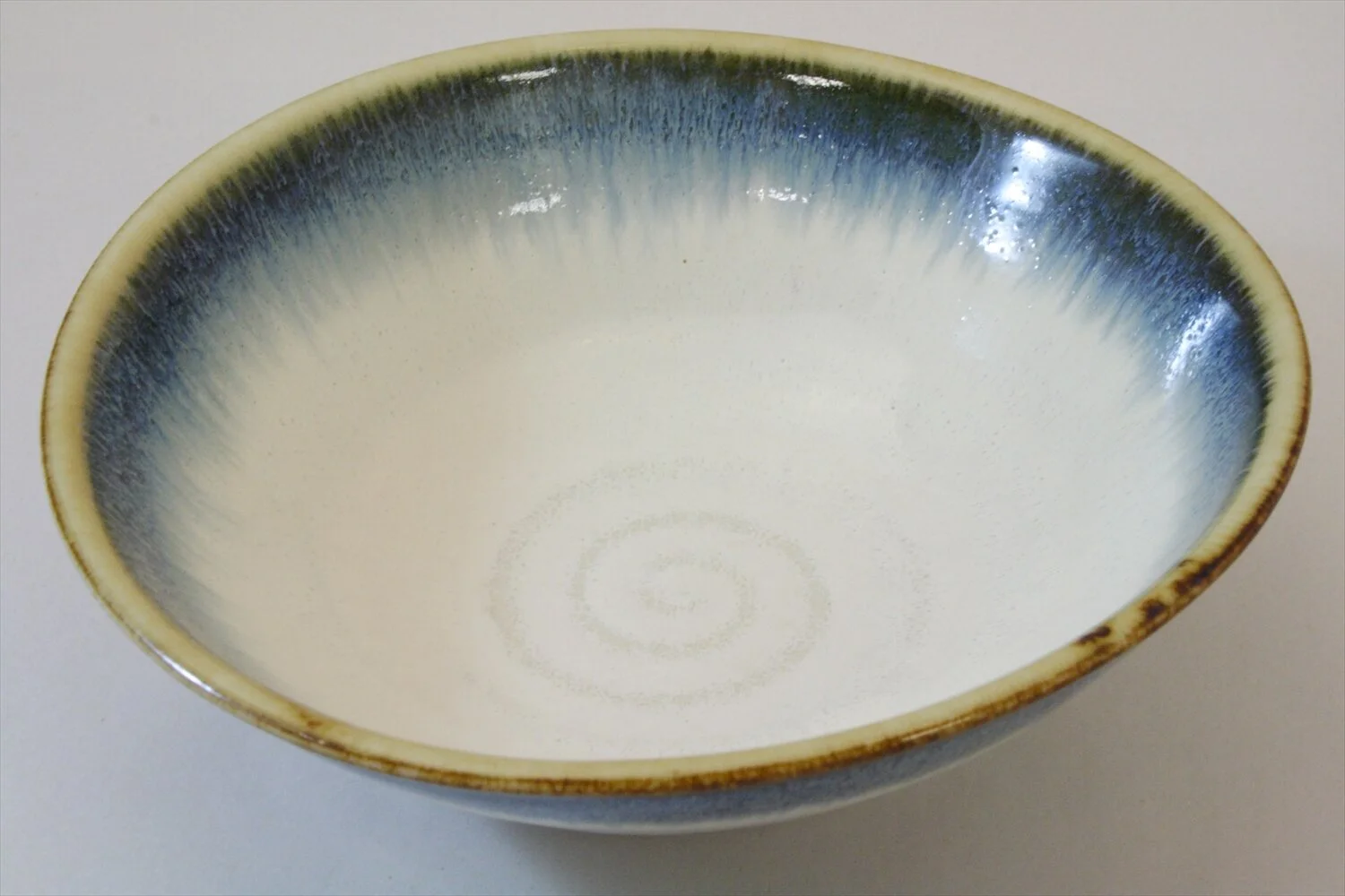228-4490 White mid oval bowl with blue edge