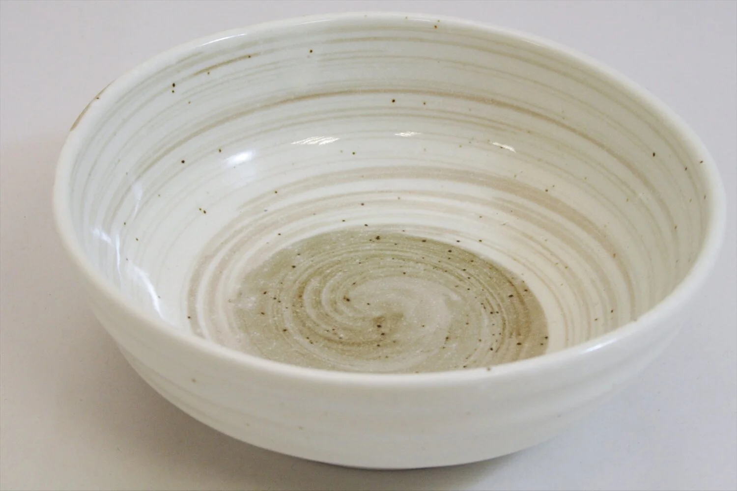 268-6049 Brown whirl on small white bowl 13cm