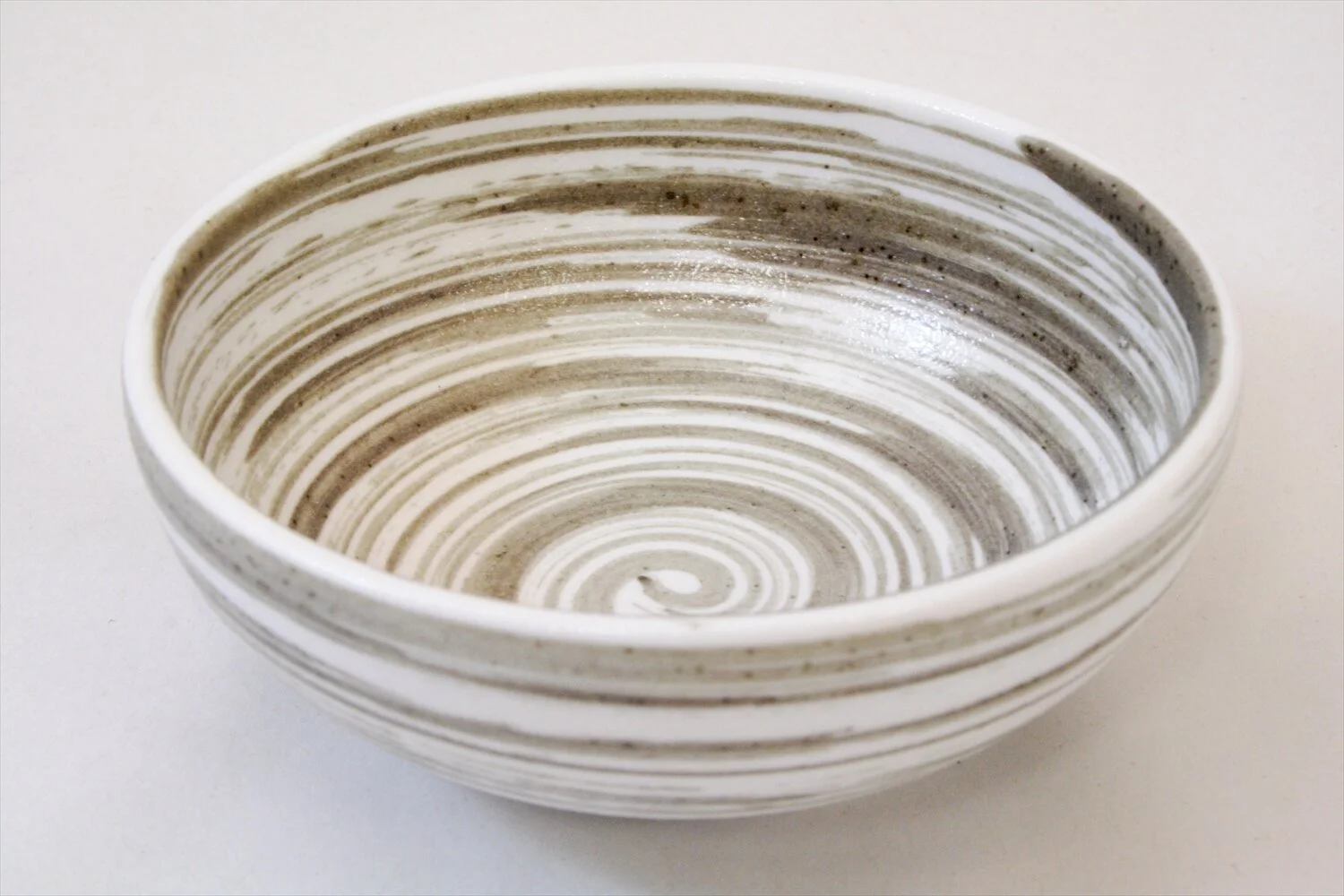 268-4106 Brown whirls on mat white small bowl