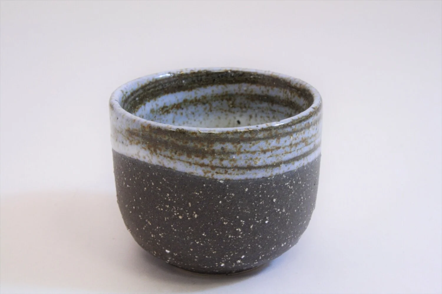 628-6106 Grey on black sake cup