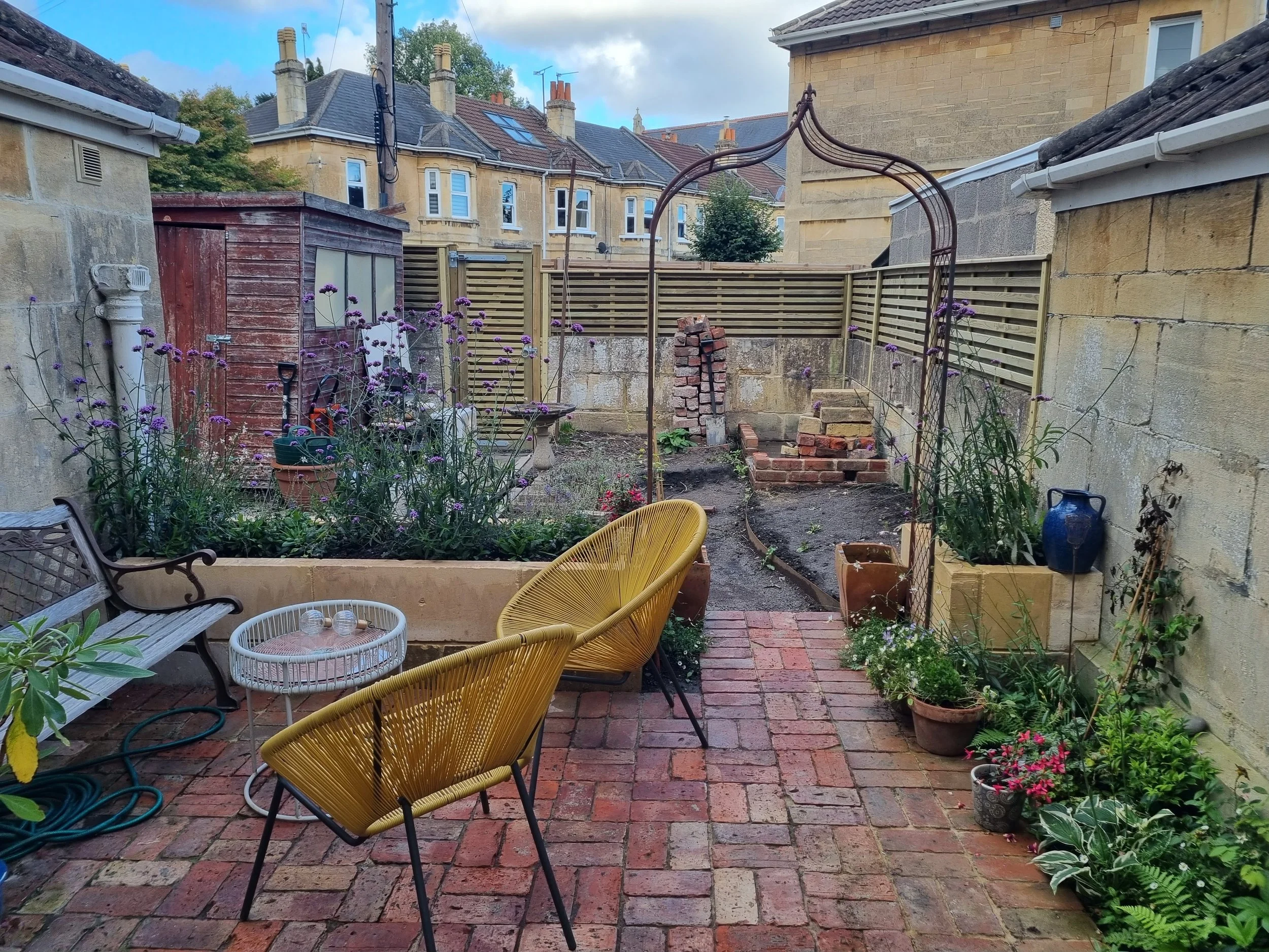 First half of the garden completed - new Venetian fencing  (sheds yet to be removed)
