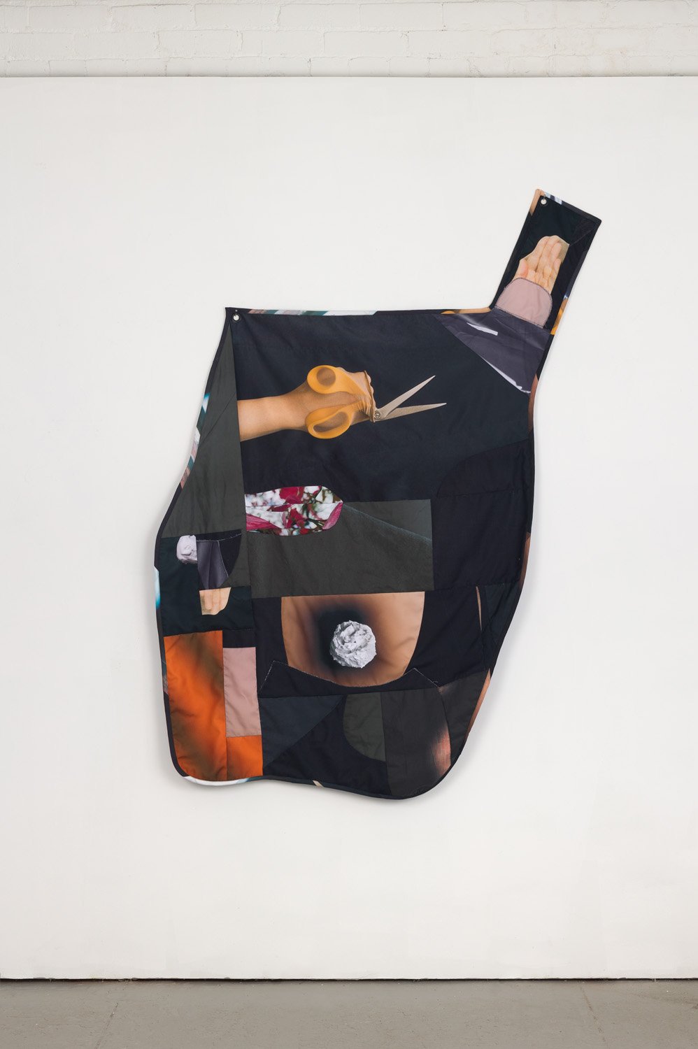 'The Cut' (2021), photographs printed on fabric, cut, pieced, and sewn, cotton batting, grommets, 65” x 40”