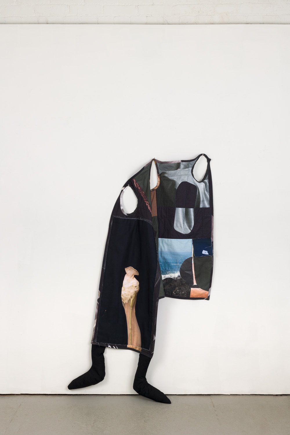  'Walk This Way' (2022), photographs printed on fabric, old clothes, cut, pieced, and sewn, cotton batting, 64” x 39” x 7”