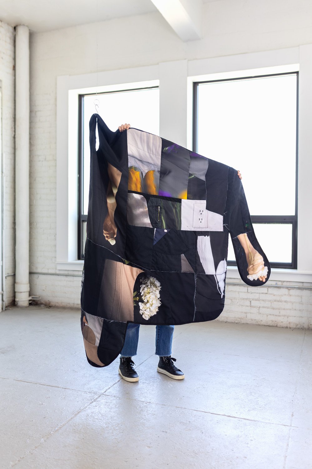 'Vent', photographs printed on fabric, old clothes, cut, pieced, and sewn, cotton batting, polyester filling, 62” x 61” (open), 68” x 19” x 15” approx. (hanging)
