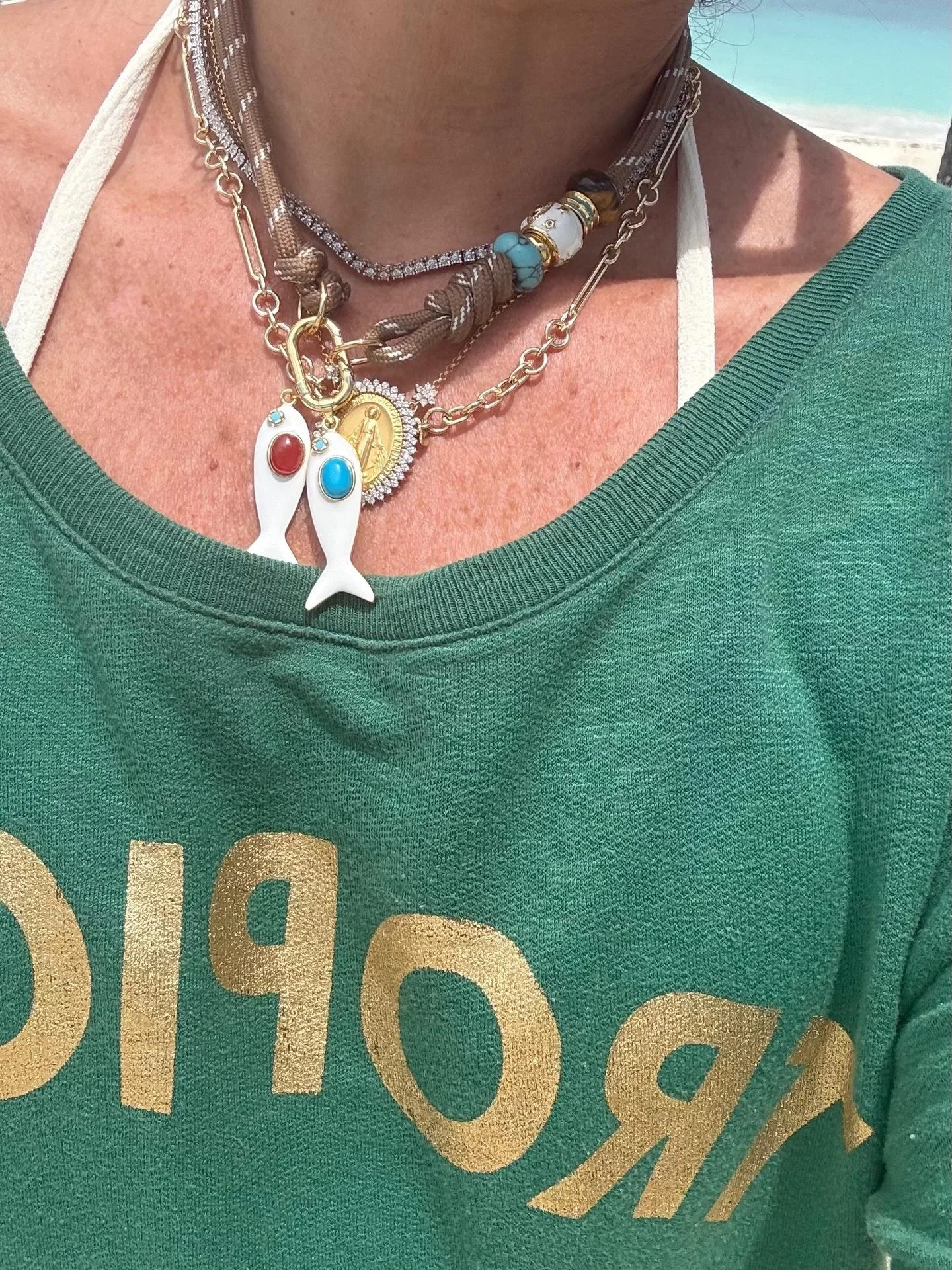 Fresh, playful, and effortlessly chic&mdash;these cord necklaces are your new go-to for spring 🐠🐟🪸🎏. Featuring glossy enamel fish pendants paired with natural stone donut charms, each piece brings a splash of color and a hint of coastal charm to 