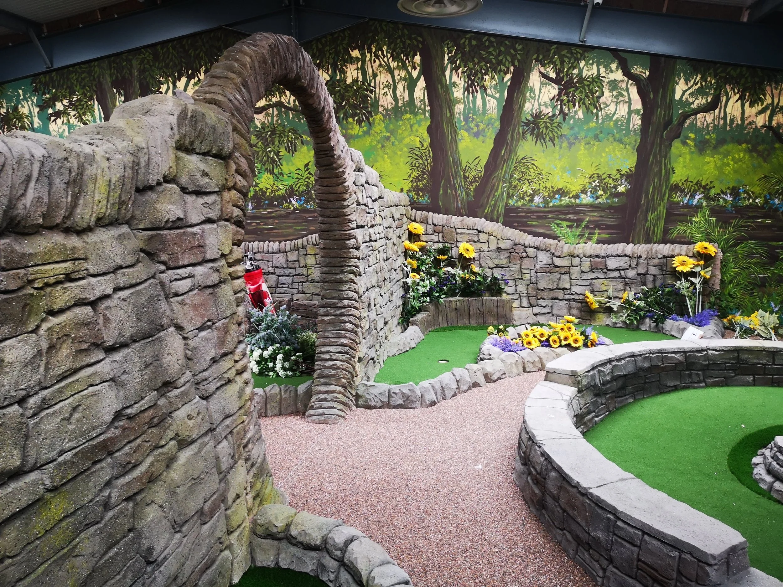 Crazy golf themed areas created from artificial rock and faux trees